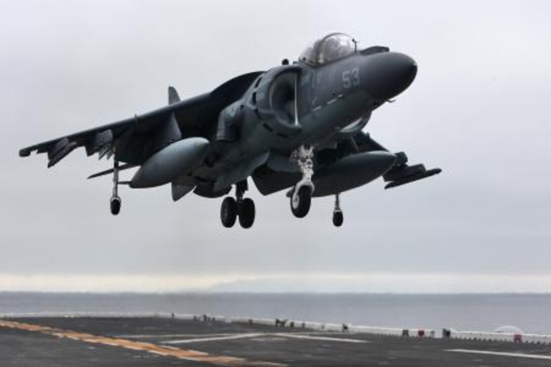 An AV-8B Harrier lands on the flight deck of the USS Peleliu as part of daily flight operations during the PHIBRON Three and 15th MEU’s PHIBRON-MEU Interoperability Training off the coast of southern California, June 1. The purpose of the exercise is to give Marines and sailors the opportunity to become familiar working together as a blue-green team, a must when it comes to flight deck operations.::r::::n::::r::::n::::r::::n::