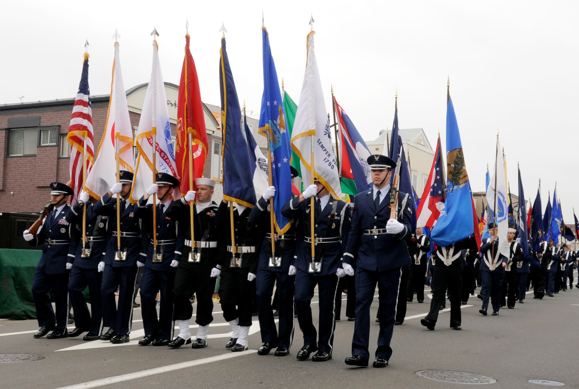 Servicemembers march in formation at Misawa City, Japan, June 03, 2012 in support of the 24th annual American Day event. American Day introduces American culture and traditions to the local Japanese community and is hosted by Misawa Air Base, Misawa City and the Misawa International Club. (U.S. Air Force photo by Airman 1st Class Kaleb Snay/Released)