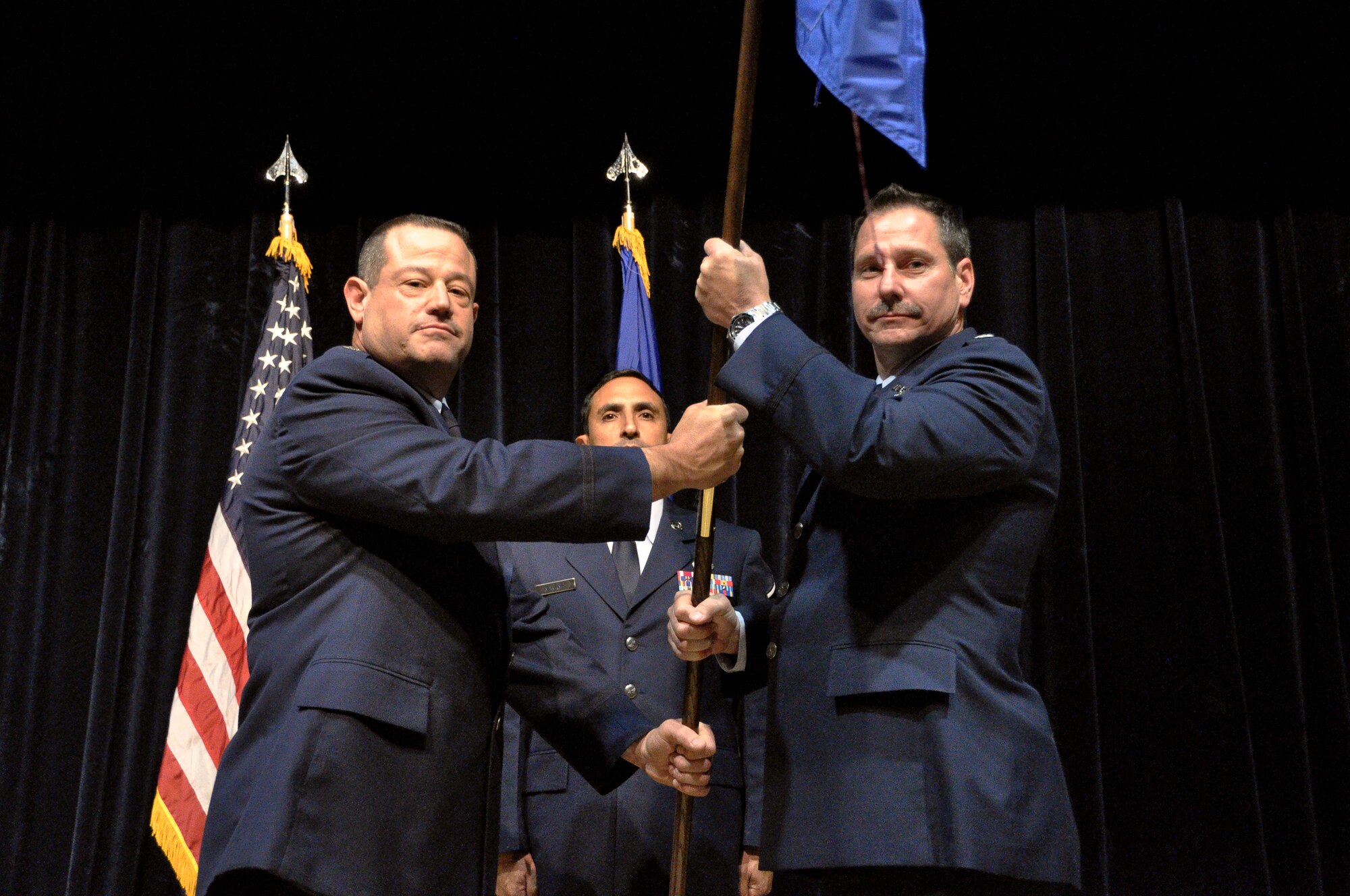 Lt. Col. Edward Gruber assumes command of the 433rd Aeromedical Evacuation Squadron during a ceremony in the Wilford Hall Ambulatory Center auditorium, Joint Base San Antonio - Lackland Air Force Base, Texas. 

The 433rd Aeromedical Staging Squadron provides medical, logistics and administrative personnel and services to support a Contingency Aeromedical Staging Facility (CASF).  Support includes flight medicine, nursing, mental health, pharmacy, dietary services, and critical care augmentation services.  They also provide emergency medical care and coordinate transportation for patients entering, en route and exiting the Aeromedical evacuation system.  The squadron deploys in support of Department of Defense contingency operations worldwide and ensures unit personnel are trained and ready to meet wartime tasks. (U.S. Air Force photo/ Senior Airman Brian McGloin)