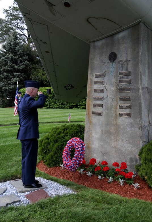 Col. Tony Gwosch places a wreath at the base of the F-100 Memorial commemorating fallen unit members during the F-100 Rededication Ceremony held at the 104th Fighter Wing on May 5, 2012.
