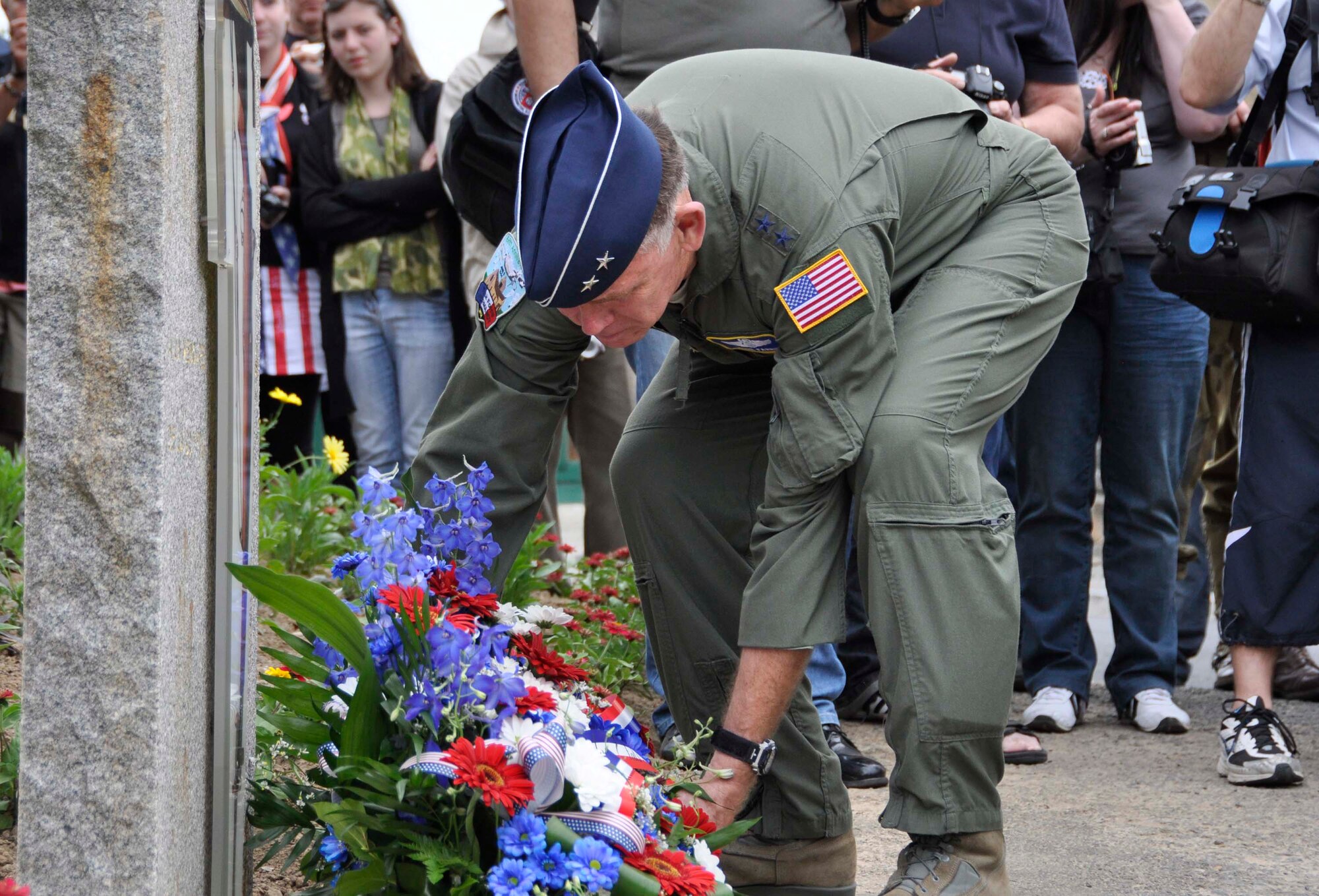 Air Force Reserve Maj. Gen. Wallace W. "Wade" Farris Jr. lays a memorial wreath June 1, 2012, on a memorial dedicated to fallen World War II U.S. aircrews and paratroopers in Picauville, France. U.S. Soldiers and Airmen, together with British paratroopers, took part in the ceremonial event commemorating the 68th Anniversary of the Normandy D-Day invasion. Later, U.S. and British forces dined with members of the Picauville community where they honored the village for their continued remembrance of the Allied invasion forces. Farris is the 22nd Air Force commander, an Air Force Reserve organization. (U.S. Air Force photo/Staff Sgt. Stephen J. Collier)