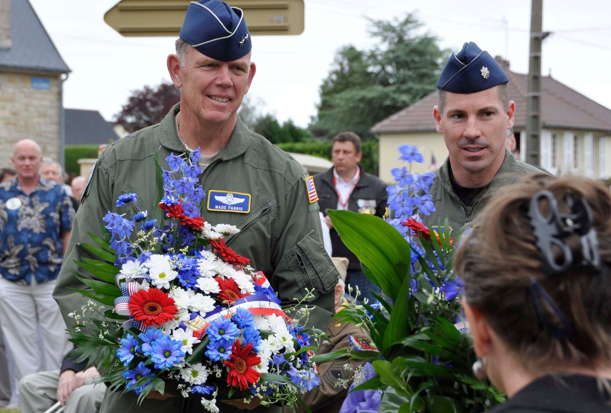 Air Force Reserve Maj. Gen. Wallace W. "Wade" Farris Jr. (left) and Lt. Col. John Lacy, assistant U.S. air attache to France with the Defense Attache Office in Paris, present wreaths June 1, 2012, to a memorial dedicated to fallen World War II U.S. aircrews and paratroopers in Picauville, France. U.S. Soldiers and Airmen, together with British paratroopers, took part in the ceremonial event commemorating the 68th Anniversary of the Normandy D-Day invasion. Later, U.S. and British forces dined with members of the Picauville community where they honored the village for their continued remembrance of the Allied invasion forces. Farris is the 22nd Air Force commander, an Air Force Reserve organization. (U.S. Air Force photo/Staff Sgt. Stephen J. Collier)