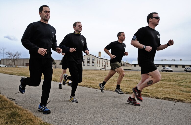 Members of the 124th Air Support Operations Squadron of the Idaho Air National Guard run laps around the Gowen Field running track March 17.  Beginning at 5 p.m. March 17 and lasting until 5 p.m. the following day, more than 30 Idaho ASOS members ran 270 miles to honor three ASOS Airmen who were killed in action during the month of March, including Maj. Greg Stone, a former Air Liaison Officer from the 124th ASOS who died March 25, 2003, in Kuwait. The 124th was one of several units from around the world to participate in the inaugural event.