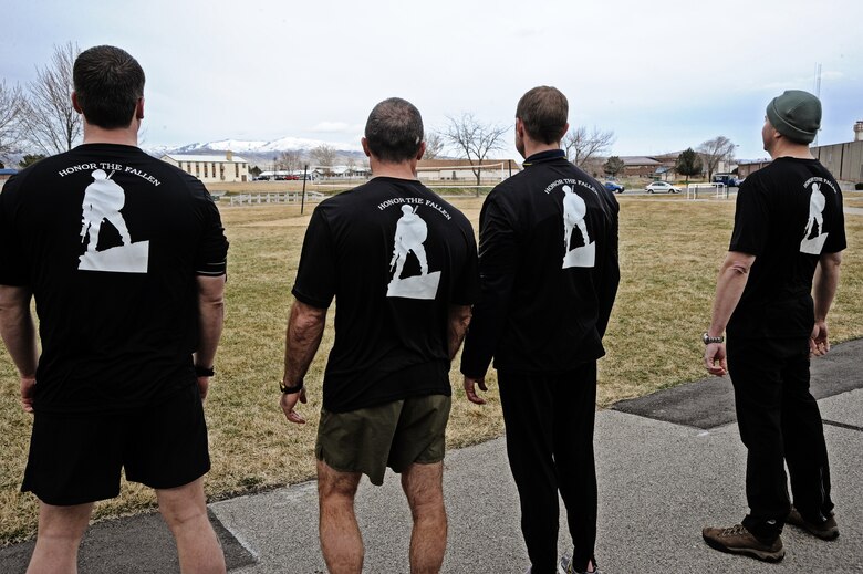 Members of the 124th Air Support Operations Squadron of the Idaho Air National Guard prepare to run laps around the Gowen Field running track March 17. Beginning at 5 p.m. March 17 and lasting until 5 p.m. the following day, more than 30 Idaho ASOS members ran 270 miles to honor three ASOS airmen who were killed in action during the month of March, including Maj. Greg Stone, a former Air Liaison officer from the 124 ASOS who died March 25, 2003, in Kuwait. The 124th was one of several units from around the world to participate in the inaugural event.