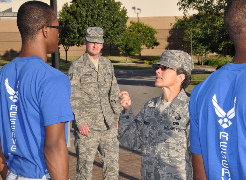 Senior Master Sgt. Sheila Croninger, facilitator, Development Training Flight, 931st Air Refueling Group corrects Alfred Sullivan while Tech. Sgt. Joe Johnson, flight leader, DTF, 931st ARG looks for discrepancies during close order drill. (Air Force photo by Tech. Sgt. Brannen Parrish)