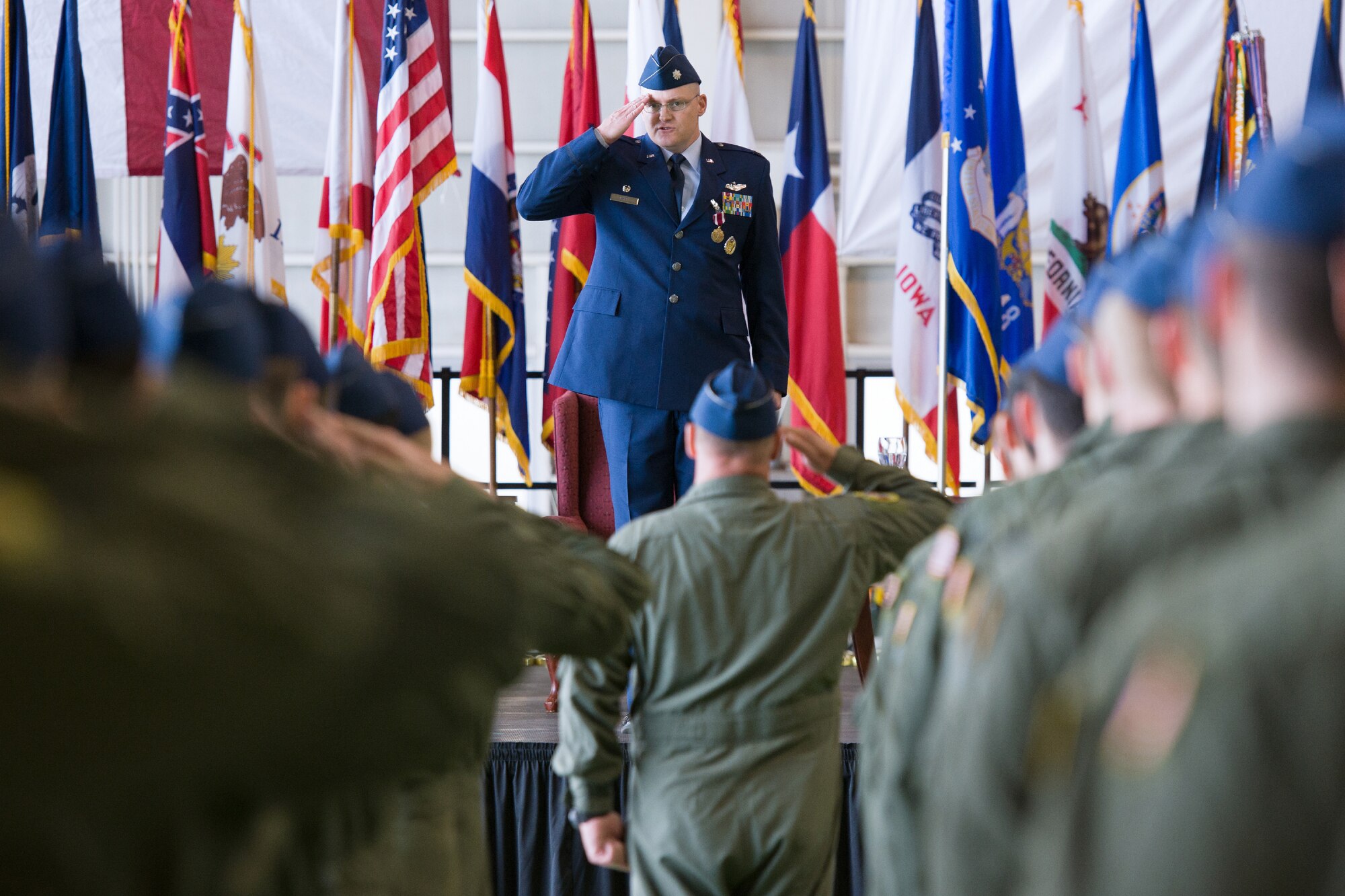YOKOTA AIR BASE, Japan -- Airmen from the 36th Airlift Squadron present their final salute to Lt. Col. Timothy Rapp as the 36th AS commander during the change of command ceremony at Yokota Air Base, Japan, on June 1, 2012. Rapp ensured the execution of deployments and international flying exercises, solidifying relationships and building interoperability with key Pacific allies. (U.S. Air Force photo by Osakabe Yasuo)