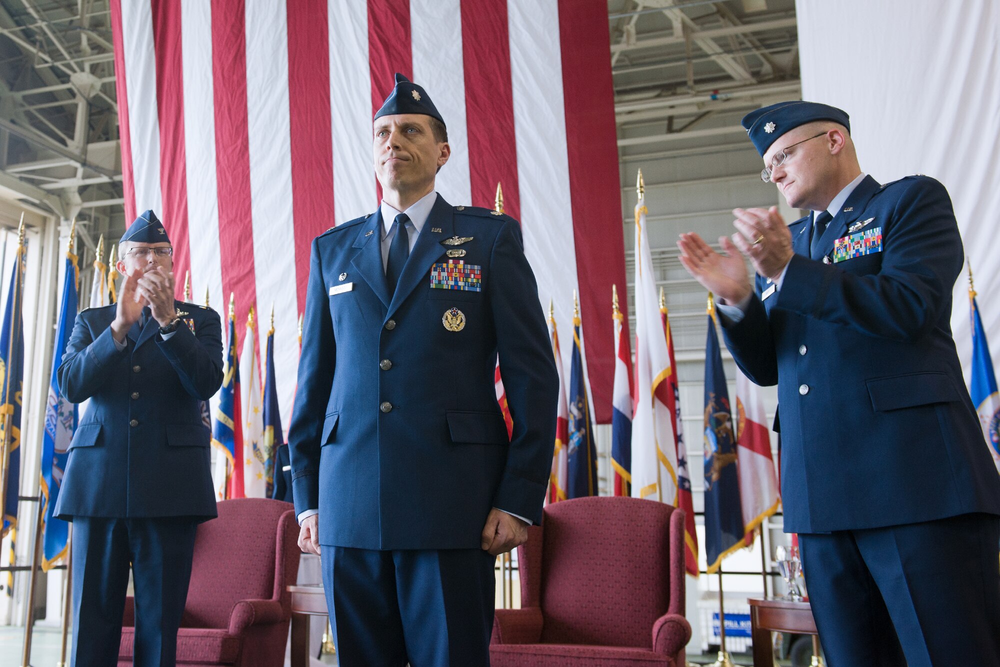 YOKOTA AIR BASE, Japan -- Lt. Col. Jeffrey Menasco, 36th Airlift Squadron commander, center, stands as the commander of the 36th AS after the change of command ceremony at Yokota Air Base, Japan, on June 1, 2012. The change of command is a traditional military ceremony in which the departing commander assembles his troops for presentation to the incoming commander. (U.S. Air Force photo by Osakabe Yasuo)