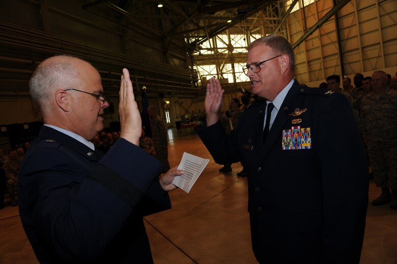 Charlotte, N.C.  -- Newly promoted Col. Marshall Collins (right) recites the National Guard Officer Oath of Office to Brig. Gen. Tony McMillan, Commander of the 145th Airlift Wing, (U.S. Air Force photo by Tech. Sgt. Brian E. Christiansen)