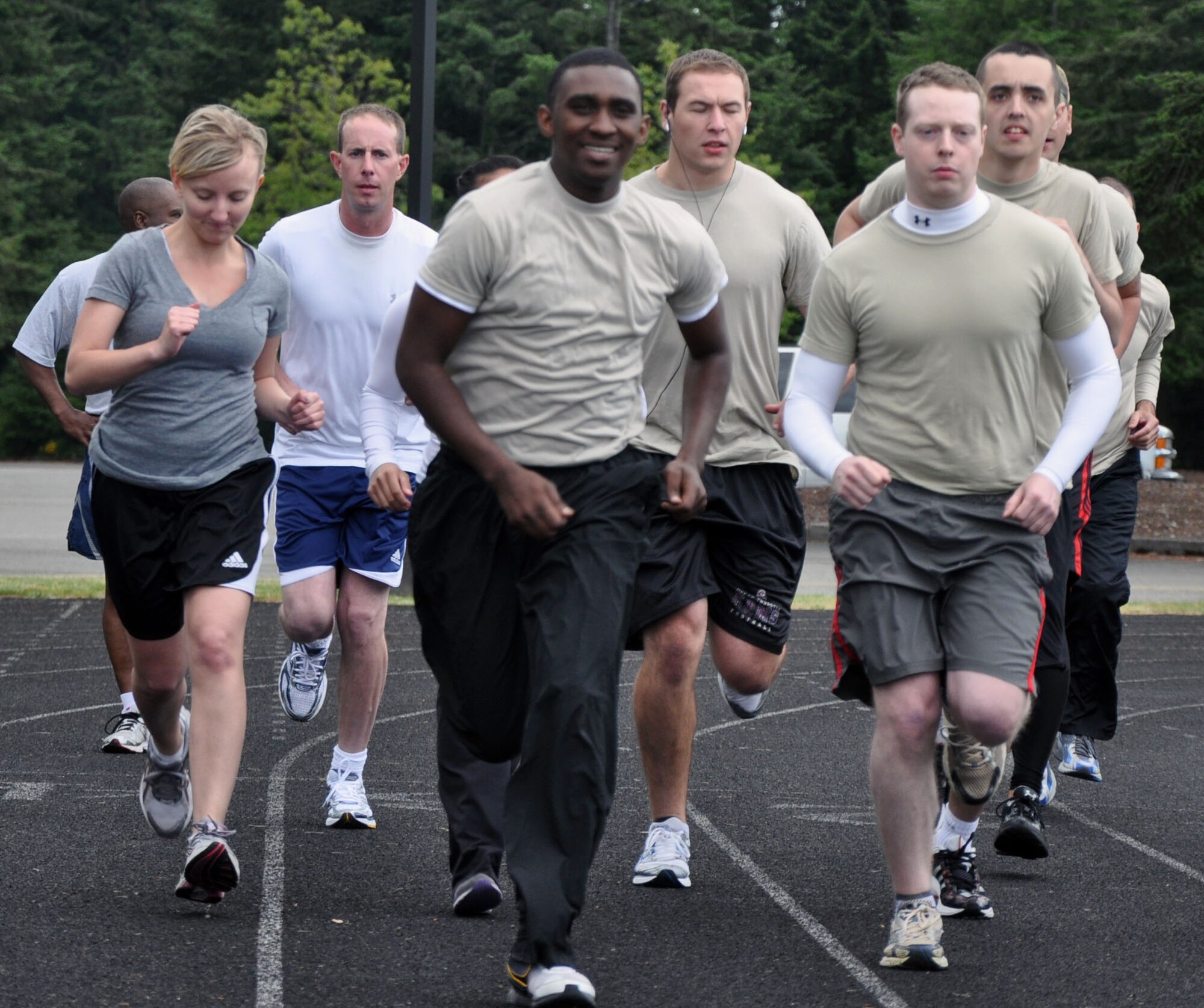 MCCHORD FIELD, Wash. – New enlistees from the Development and Training Flight here, prepare for Basic Military Training and their new Reserve careers with physical training led by recruiters from the Western Recruiting Squadron, June 2.  Challenged to enlist Reservists in the diverse career fields throughout the 446th Airlift Wing and other wings throughout the country, 446th AW senior recruiter, Chief Master Sgt. Scott Terpening and his team claimed the WRS Top Large Operating Location Award with 98 accessions (enlistments) for the fiscal year second-quarter.  (U.S. Air Force photo by Tech. Sgt. Elizabeth Moody)