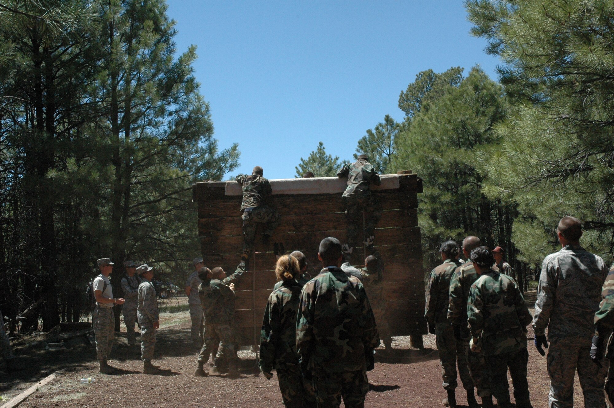 Junior ROTC cadets climb over one of the ostacles during the Senior Leadership School May 26 to June 1 at Camp Navajo, Flagstaff, Ariz. In addition to the obstacle course, cadets performed exercises in land navigation, drill and ceremony, academics, and mental and psychological tests. (U.S. Air Force photo by 2nd Lt. Rebecca Garcia/released)