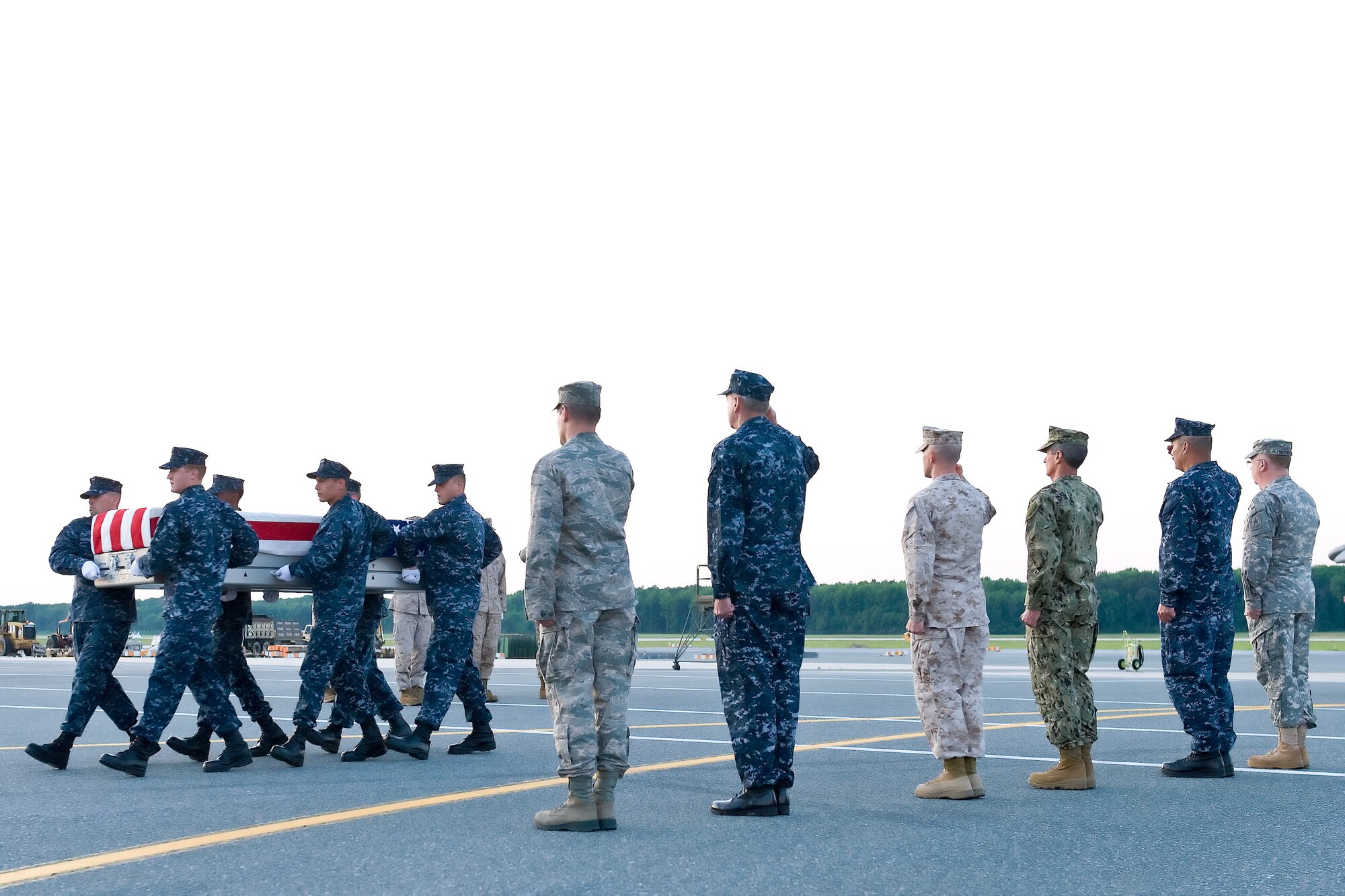 A U.S. Navy carry team transfers the remains of Navy Petty Officer 2nd Class Sean E. Brazas, of Greensboro, N.C., at Dover Air Force Base, Del., June 2, 2012. Brazas was assigned to Naval Base Kitsap Security Detachment in Bremerton, Wash. (U.S. Air Force photo/Roland Balik)
