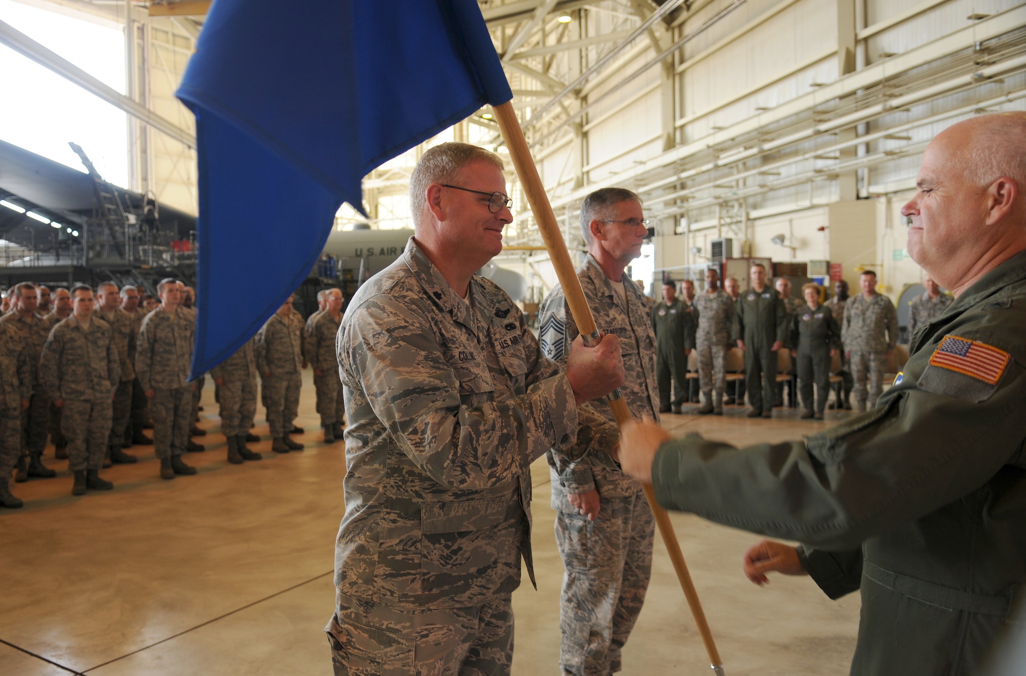 Charlotte, N.C. -- Lt. Col. Marshall Collins accepts command of the 145th Maintenance Group from Brig. Gen. Tony McMillan at the change of command ceremony June 2, 2012. (U.S. Air Force photo by Tech. Sgt. Brian E. Christiansen)