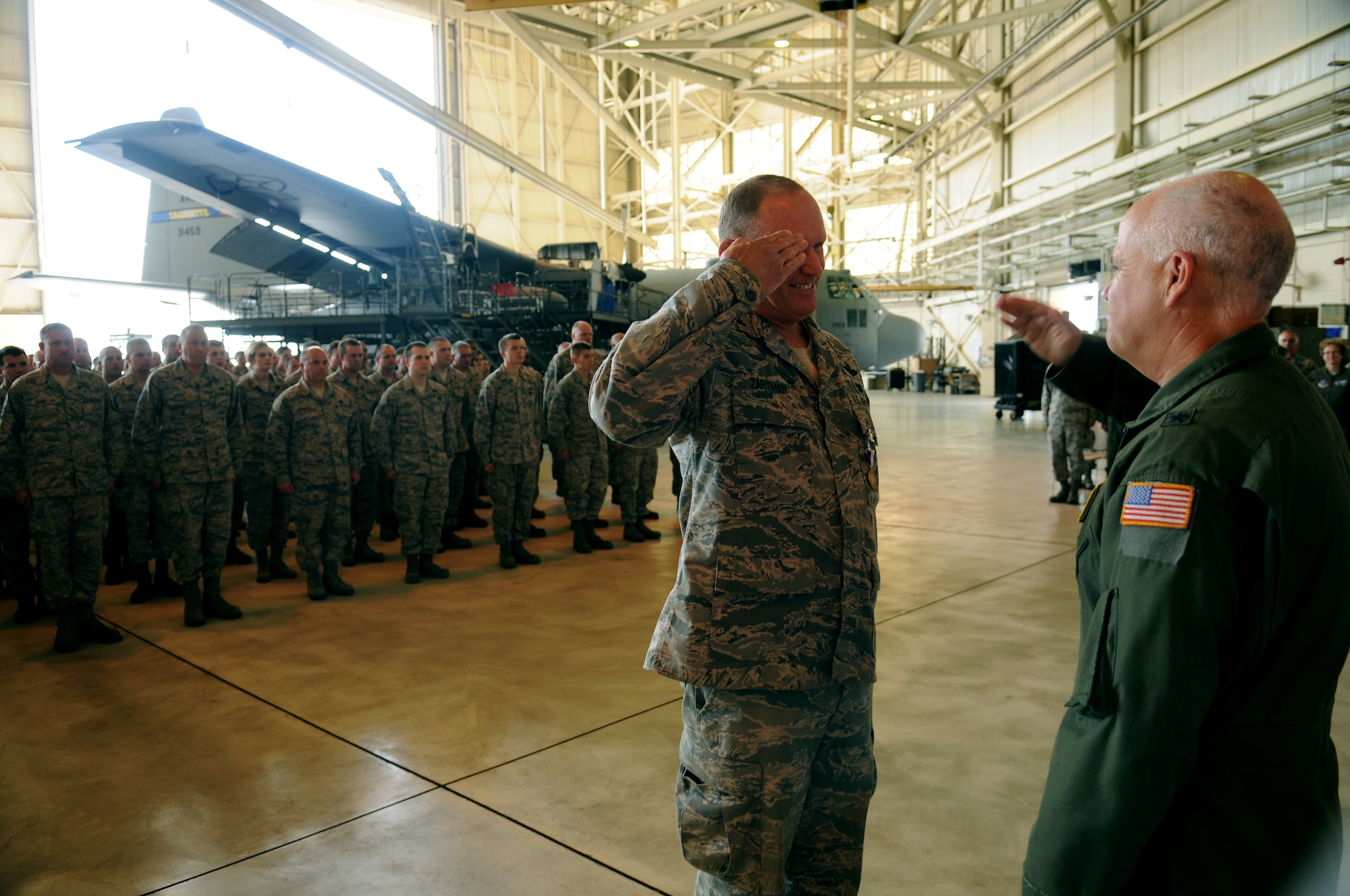 Charlotte, N.C. -- Col David Zartman, outgoing commander of the 145th Maintenance Group (left) salutes Brig. Gen. Tony McMillan at the conclusion of the change of command ceremony on June 2nd, 2012.   (U.S. Air Force photo by Tech. Sgt. Brian E. Christiansen)