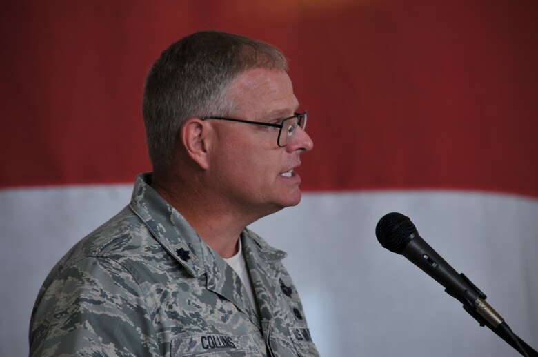 Charlotte, N.C. -- Lt. Col. Marshall Collins accepts command of the 145th Maintenance Group from Brig. Gen. Tony McMillan at the change of command ceremony June 2, 2012. (U.S. Air Force photo by Tech. Sgt. Brian E. Christiansen)