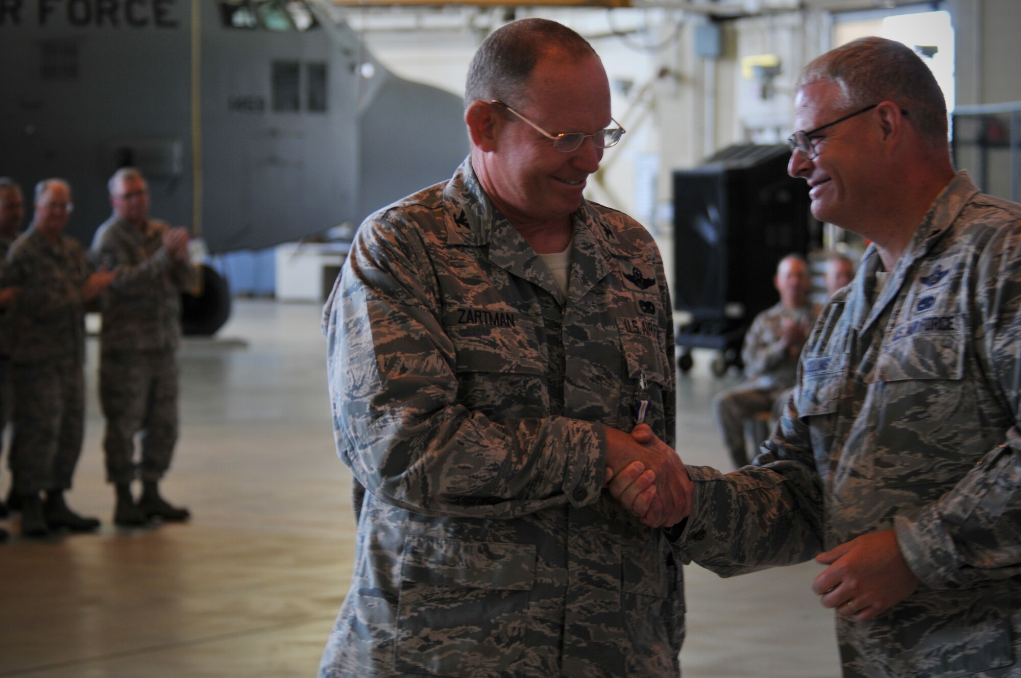 Charlotte, N.C. -- Lt Col Marshall Collins (right), congratulates Col David Zartman after
their change of command ceremony June 2, 2012. (U.S. Air Force photo by Tech. Sgt. Brian E. Christiansen)
