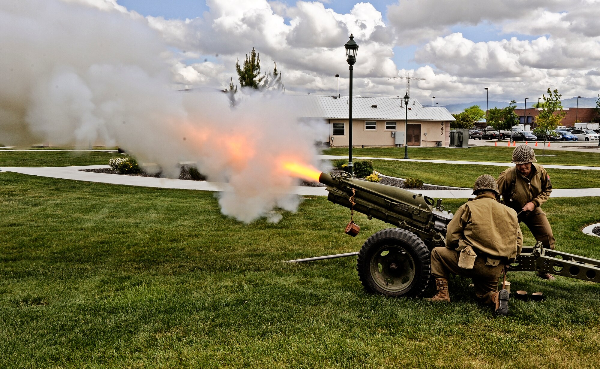 The Idaho Military History Museum supplied a fire detail for this 75mm Pack Howitzer that fired off three rounds at the conclusion of the ceremony May 24.One area resident brought down this WWII-era family photo of her late husband, who is memorialized with one of the many bricks at the Gowen Field Memorial Park just inside the main gate. (Air Force Photo by Tom Gloekle)