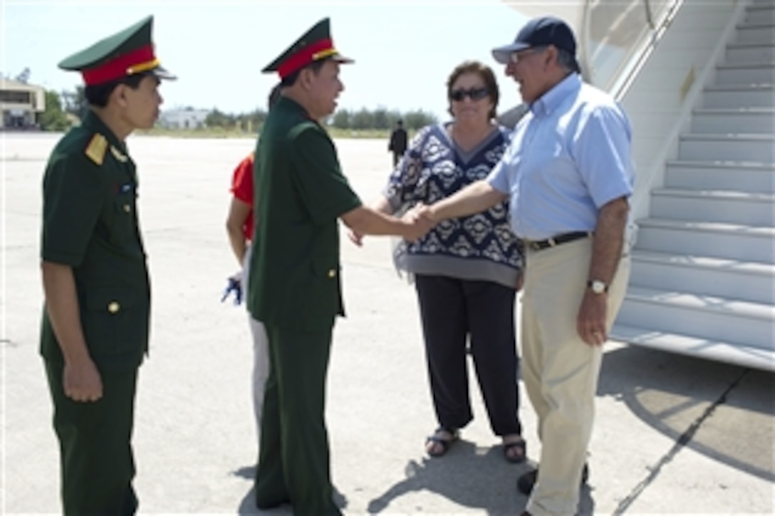 U.S. Defense Secretary Leon E. Panetta is greeted by Vietnamese Army Maj. Gen. Nguyen Cong Son, deputy chief of the office of the minister of defense, upon arrival in Cam Ranh Bay, Vietnam,  June 3, 2012.  Panetta is the first defense secretary and the highest-ranking U.S. official to visit the Vietnamese port since the end of the Vietnam war in 1975 and the normalization of relations between the U.S. and Vietnam 17 years ago.