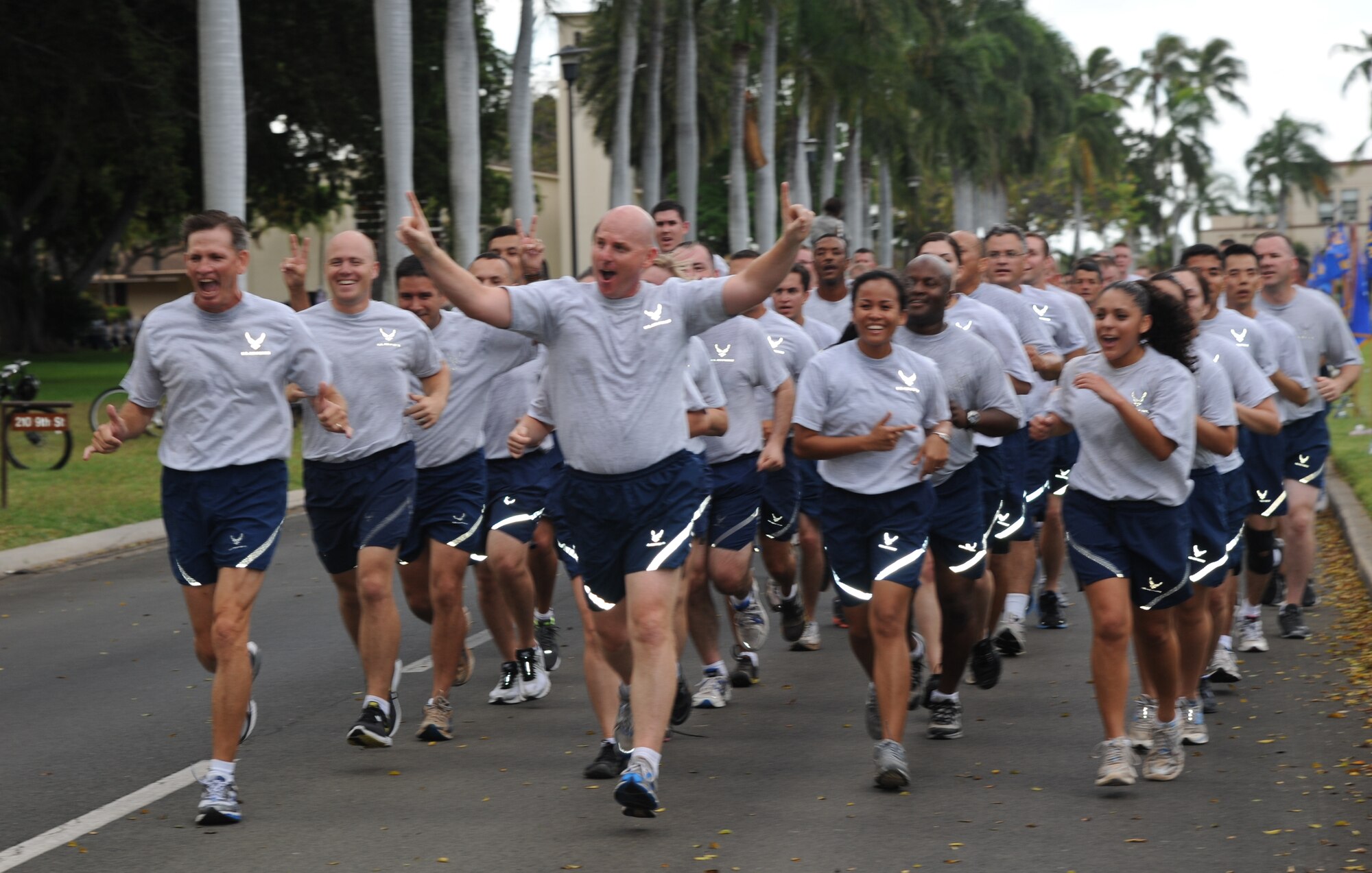Col. Sam Barrett, 15th Wing commander, leads a formation of 15th Wing Airmen during the monthly Warrior Run June 1 at Joint Base Pearl Harbor-Hickam, Hawaii. While the Warrior Run takes place monthly, this run marked the final time Barrett and Col. Joe Dague, 15th Wing vice commander, would participate while occupying those positions. (U.S. Air Force photo by Senior Airman Lauren Main)