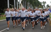 Col. Sam Barrett, 15th Wing commander, leads a formation of 15th Wing Airmen during the monthly Warrior Run June 1 at Joint Base Pearl Harbor-Hickam, Hawaii. While the Warrior Run takes place monthly, this run marked the final time Barrett and Col. Joe Dague, 15th Wing vice commander, would participate while occupying those positions. (U.S. Air Force photo by Senior Airman Lauren Main)