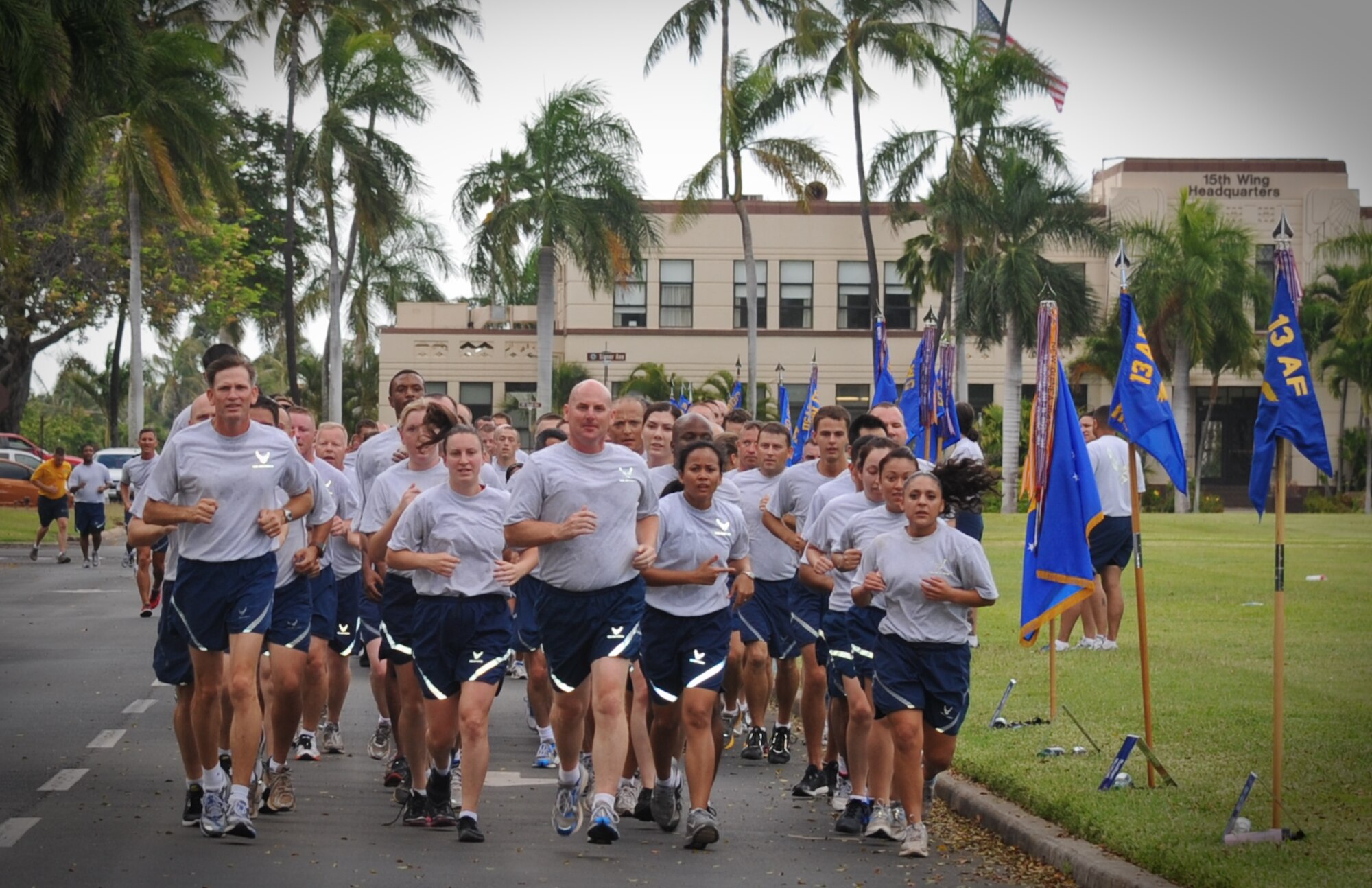 Col. Sam Barrett, 15th Wing commander, leads a formation of 15th Wing Airmen during the monthly Warrior Run June 1 at Joint Base Pearl Harbor-Hickam, Hawaii. While the Warrior Run takes place monthly, this run marked the final time Barrett and Col. Joe Dague, 15th Wing vice commander, would participate while occupying those positions. (U.S. Air Force photo by Senior Airman Lauren Main)