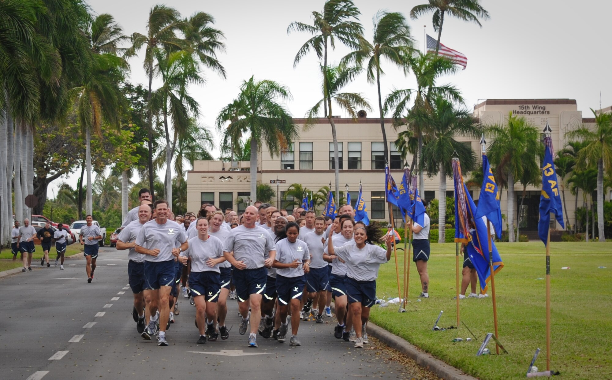 Col. Sam Barrett, 15th Wing commander, leads a formation of 15th Wing Airmen during the monthly Warrior Run June 1 at Joint Base Pearl Harbor-Hickam, Hawaii. While the Warrior Run takes place monthly, this run marked the final time Barrett and Col. Joe Dague, 15th Wing vice commander, would participate while occupying those positions. (U.S. Air Force photo by Senior Airman Lauren Main)