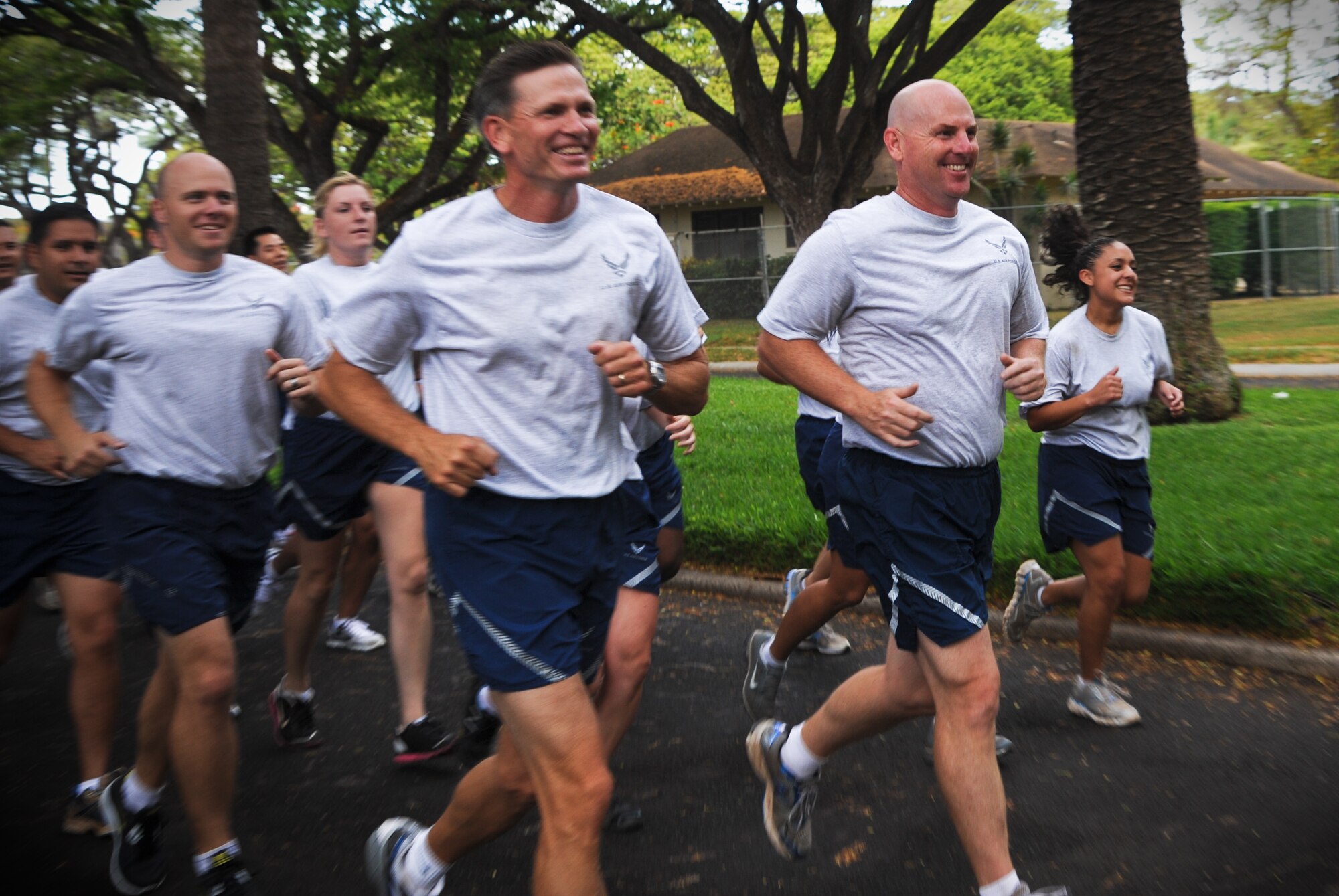 Col. Joe Dague, 15th Wing vice commander (left) and Col. Sam Barrett, 15th Wing commander, lead a formation of 15th Wing Airmen during the monthly Warrior Run June 1 at Joint Base Pearl Harbor-Hickam, Hawaii. While the Warrior Run takes place monthly, this run marked the final time Barrett and Joe Dague would participate while occupying those positions. (U.S. Air Force photo by Senior Airman Lauren Main)