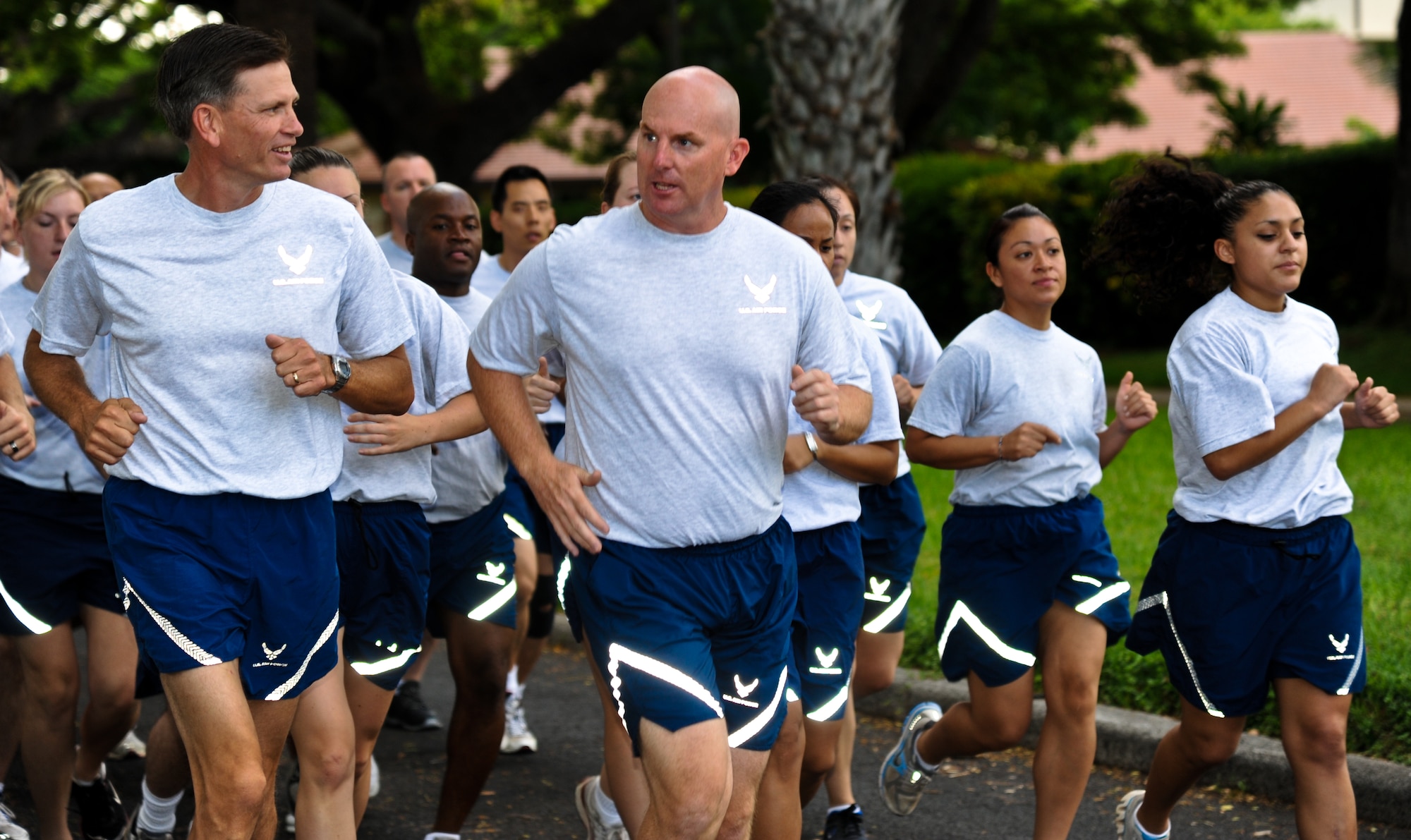 Col. Joe Dague, 15th Wing vice commander (left) and Col. Sam Barrett, 15th Wing commander, lead a formation of 15th Wing Airmen during the monthly Warrior Run June 1 at Joint Base Pearl Harbor-Hickam, Hawaii. While the Warrior Run takes place monthly, this run marked the final time Barrett and Joe Dague would participate while occupying those positions. (U.S. Air Force photo by Senior Airman Lauren Main)
