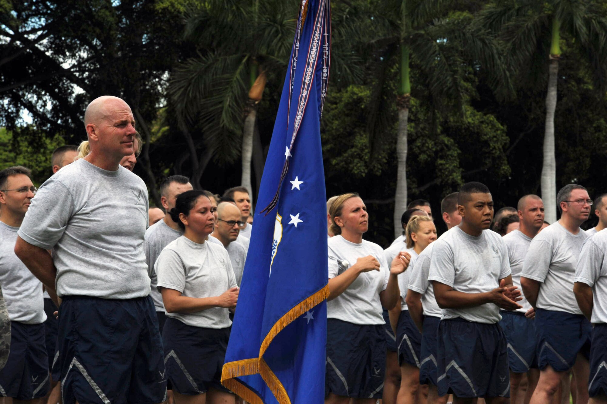 Col. Sam Barrett, 15th Wing commander, stands in front of 15th Wing Airmen in formation behind him before the Warrior Run June 1 and Joint Base Pearl Harbor-Hickam, Hawaii. While the Warrior Run takes place monthly, this run marked the final time Barrett and Col. Joe Dague, 15th Wing vice commander, would participate while occupying those positions. (U.S. Air Force photo by Staff Sgt. Nathan Allen)