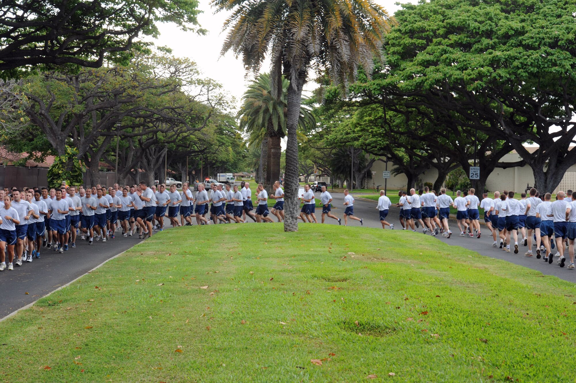 Airmen from Joint Base Pearl Harbor Hickam, Hawaii, make a turn during the Warrior Run June 1. While the Warrior Run takes place monthly, this run marked the final time Col. Sam Barrett, 15th Wing commander, and Col. Joe Dague, 15th Wing vice commander, would participate while occupying those positions. (U.S. Air Force photo by Staff Sgt. Nathan Allen)