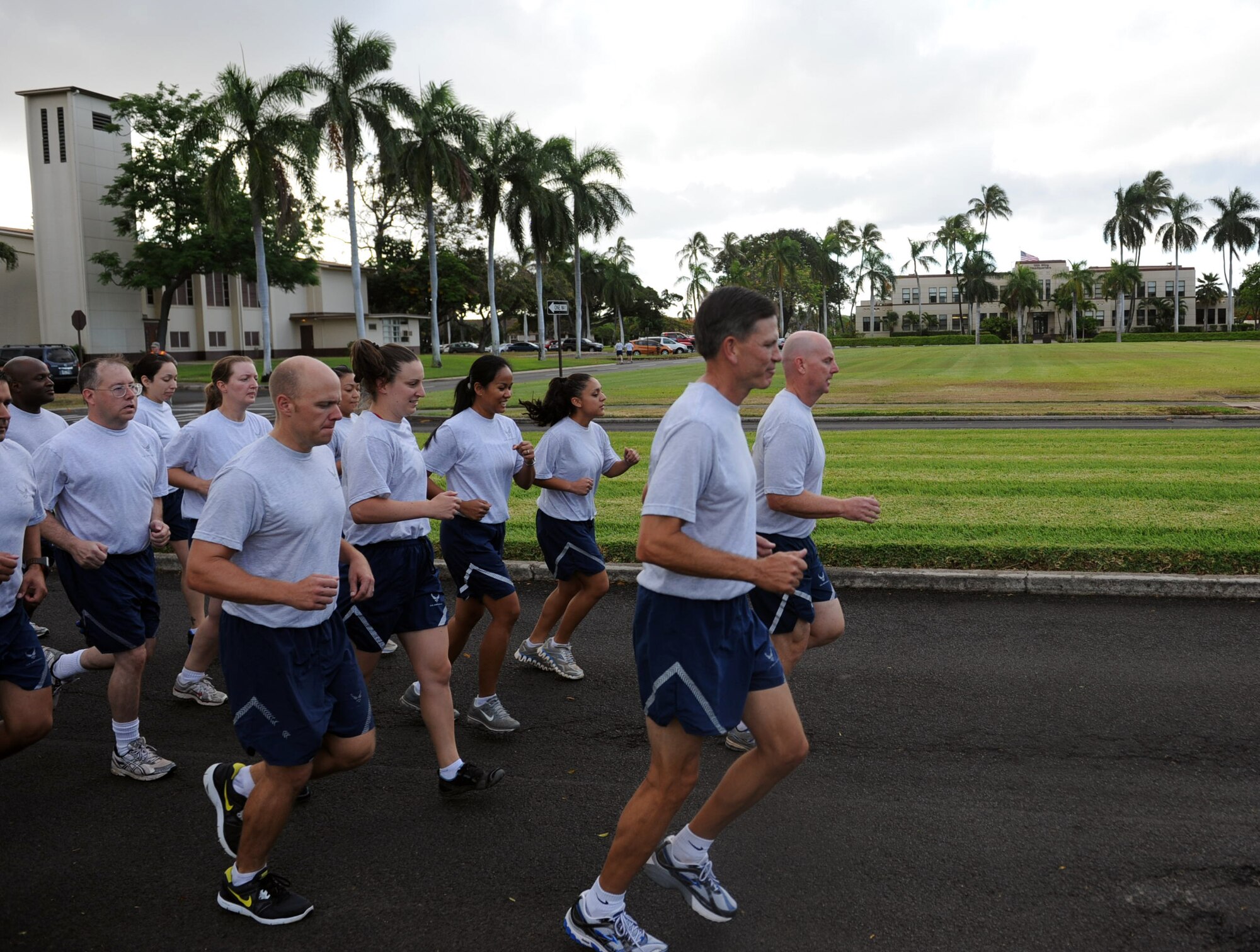 Col. Sam Barrett, 15th Wing commander, and Col. Joe Dague, 15th Wing vice commander, begin running during the monthly Warrior Run June 1 at Joint Base Pearl Harbor Hickam, Hawaii. While the Warrior Run takes place monthly, this run marked the final time Barrett and Dague would participate while occupying those positions. (U.S. Air Force photo by Staff Sgt. Nathan Allen)