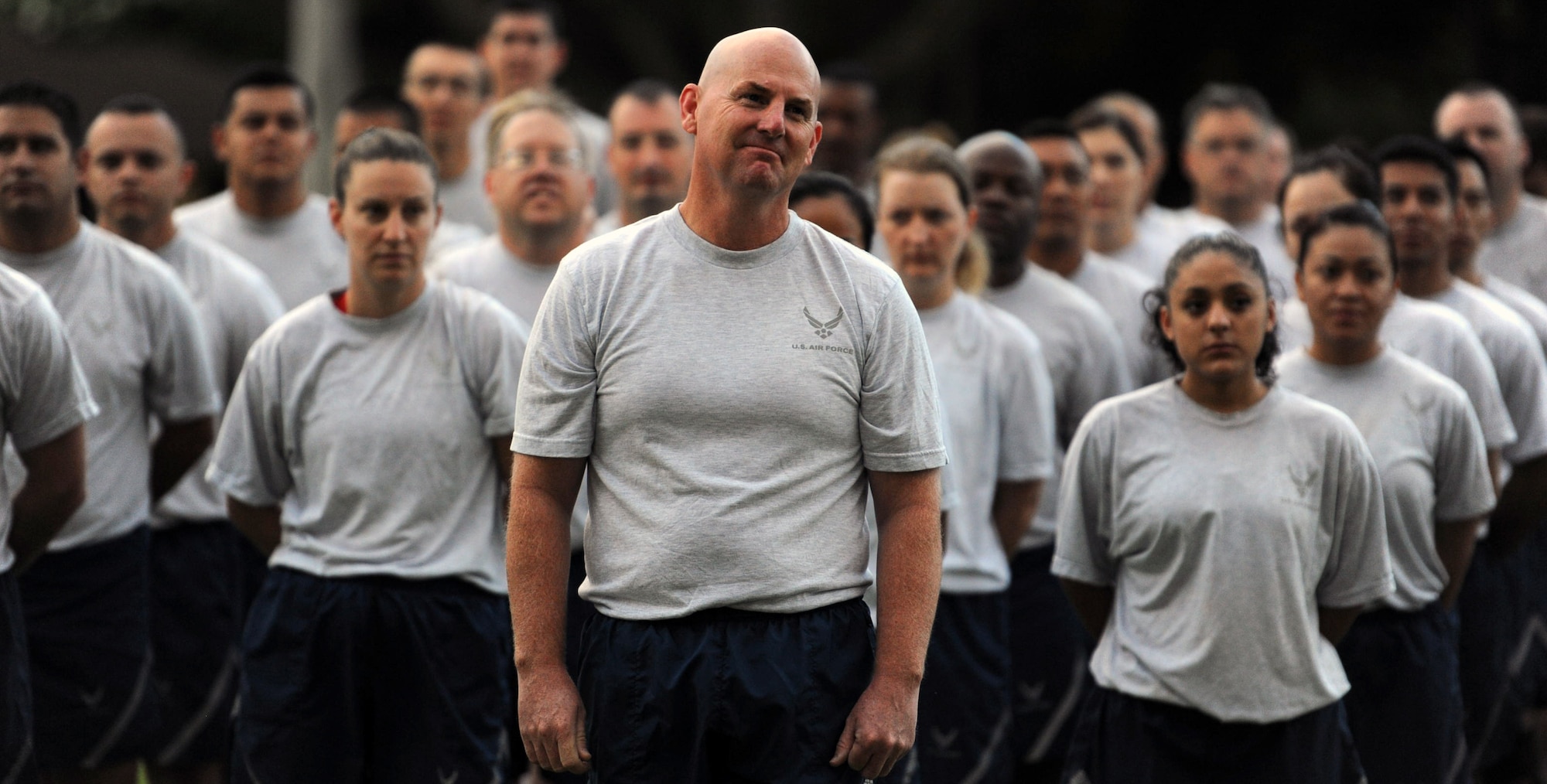 Col. Sam Barrett, 15th Wing commander, stands in front of 15 WG Airmen in formation behind him before the Warrior Run June 1 and Joint Base Pearl Harbor-Hickam, Hawaii. While the Warrior Run takes place monthly, this run marked the final time Barrett and Col. Joe Dague, 15th Wing vice commander, would participate while occupying those positions. (U.S. Air Force photo by Staff Sgt. Nathan Allen)