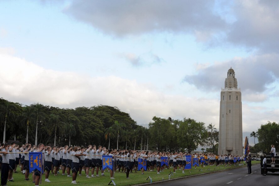 Units across Joint Base Pearl Harbor Hickam, Hawaii, stand in formation before the Warrior Run June 1. While the Warrior Run takes place monthly, this run marked the final time Col. Sam Barrett, 15th Wing commander, and Col. Joe Dague, 15th Wing vice commander, would participate while occupying those positions. (U.S. Air Force photo by Staff Sgt. Nathan Allen)