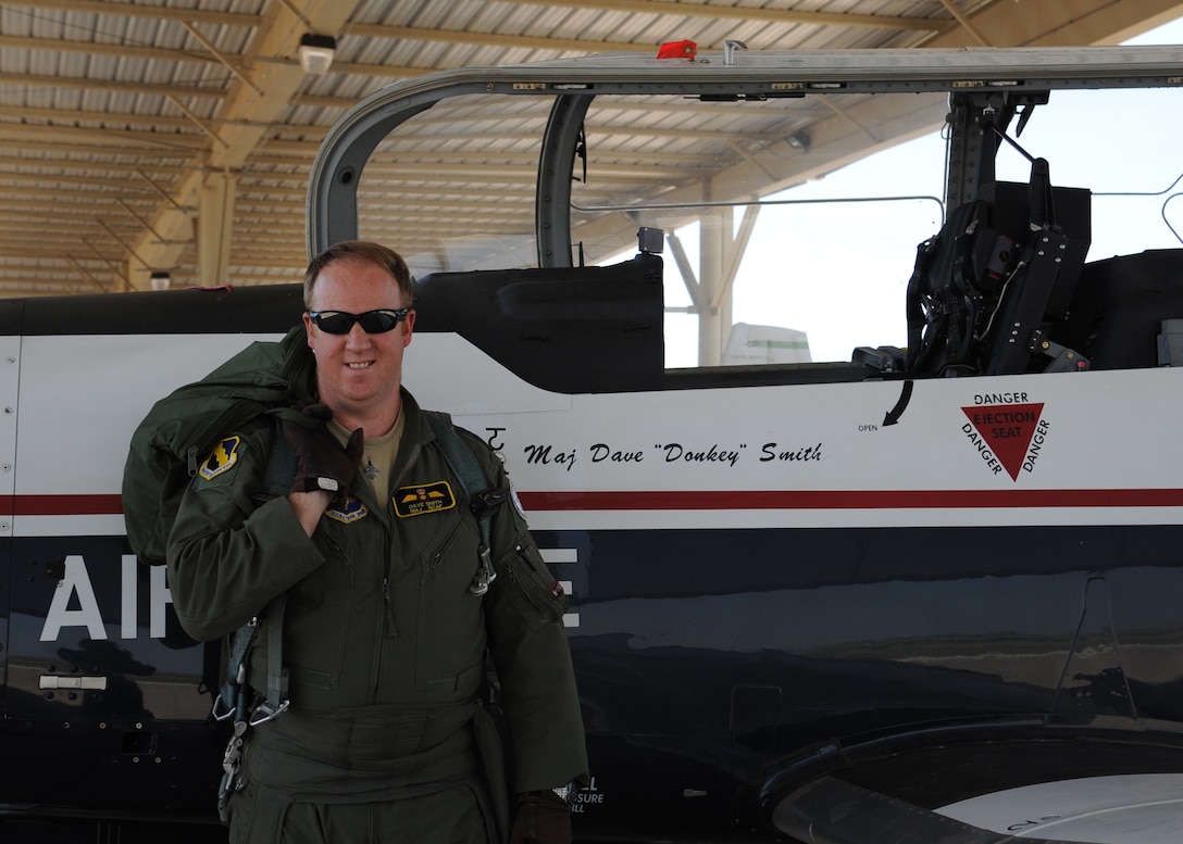 Maj. David Smith, Canadian senior national representative for the Euro-NATO Joint Jet Pilot Training program, gears up and prepares for flight in a T-6A Texan II May 31, 2012. Smith reached a personal goal and surpassed a 3,000 flight hour career milestone, and is now ranked second in the world for flight hours in the T-6. (U.S. Air Force photo/ Senior Airman Adawn Kelsey)