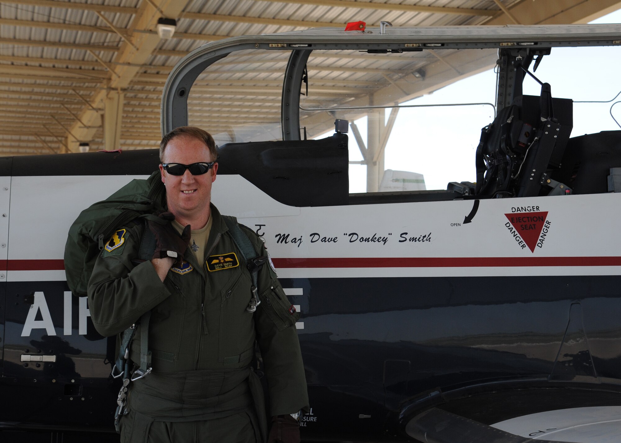Maj. David Smith, Canadian senior national representative for the Euro-NATO Joint Jet Pilot Training program, gears up and prepares for flight in a T-6A Texan II May 31, 2012. Smith reached a personal goal and surpassed a 3,000 flight hour career milestone, and is now ranked second in the world for flight hours in the T-6. (U.S. Air Force photo/ Senior Airman Adawn Kelsey)