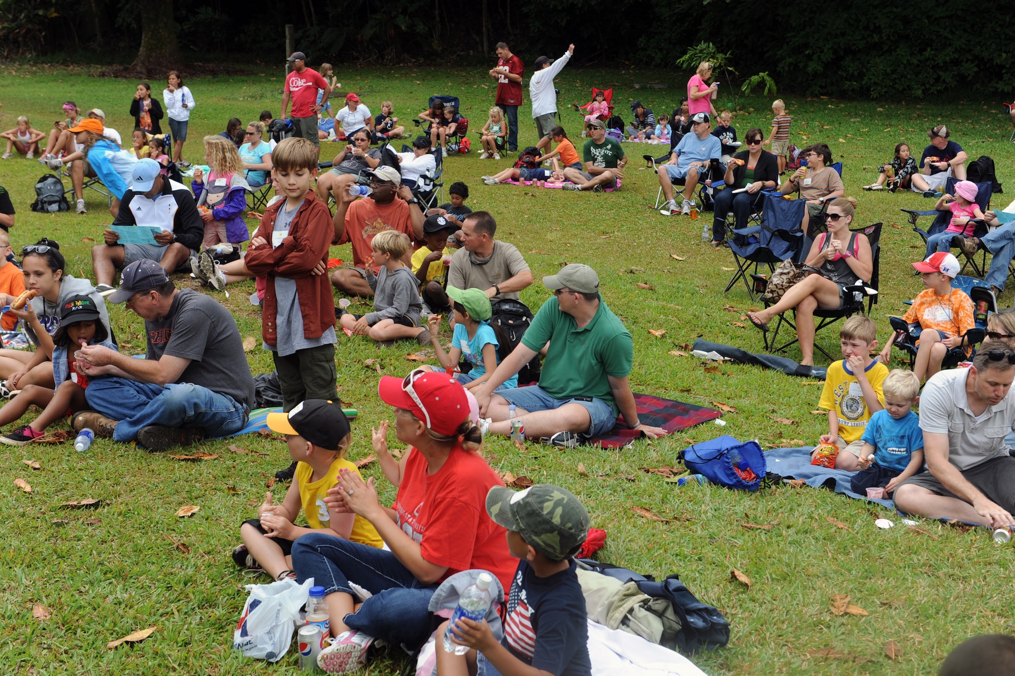 Participants in the 2012 Keiki Fishing Tournament wait for the dissemination of prizes May 30 at Ho'omaluhia Botanical Gardens in Kaneohe, Hawaii. The fishing tournament was sponsored by the Friends of Hickam, a group of community leaders who facilitate between the 15th Wing and the Hawaii community seeking to support, promote, and foster stronger community relations with those associated with the 15th Wing. (U.S. Air Force photo by Staff Sgt. Nathan Allen)