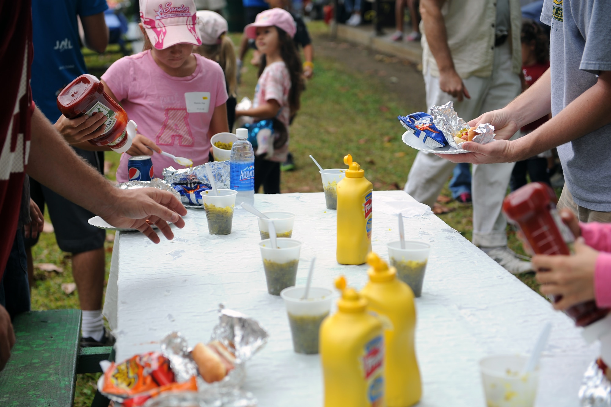 Participants in the 2012 Keiki Fishing Tournament eat lunch May 30 at Ho'omaluhia Botanical Gardens in Kaneohe, Hawaii. The fishing tournament was sponsored by the Friends of Hickam, a group of community leaders who facilitate between the 15th Wing at Joint Base Pearl Harbor-Hickam, Hawaii, and the Hawaii community seeking to support, promote, and foster stronger community relations with those associated with the 15th Wing. (U.S. Air Force photo by Staff Sgt. Nathan Allen)