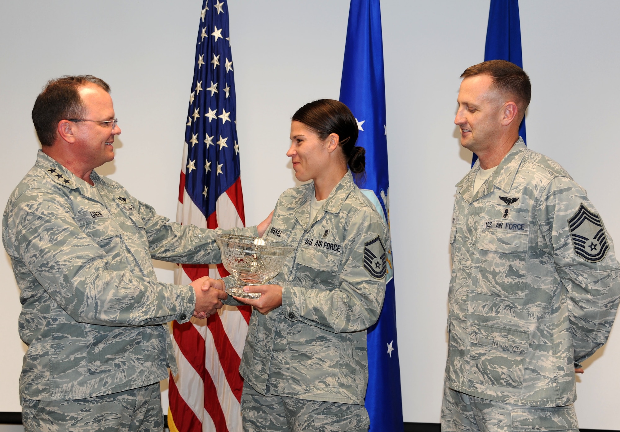 Master Sgt. Lorraine A. Hieskill, superintendent of the 59th Surgical Inpatient Squadron, is awarded the first Air Force Medical Service Senior NCO Leadership Award May 29 at the San Antonio Military Medical Center, Ft. Sam Houston. The award was presented by Lt. Gen. Charles B. Green, Surgeon General of the Air Force and Chief Master Sgt. Charles R. Cole, Chief, Medical Enlisted Force, Office of the Surgeon General. (U.S. Air Force Photo/Staff Sgt. Micky M. Bazaldua)