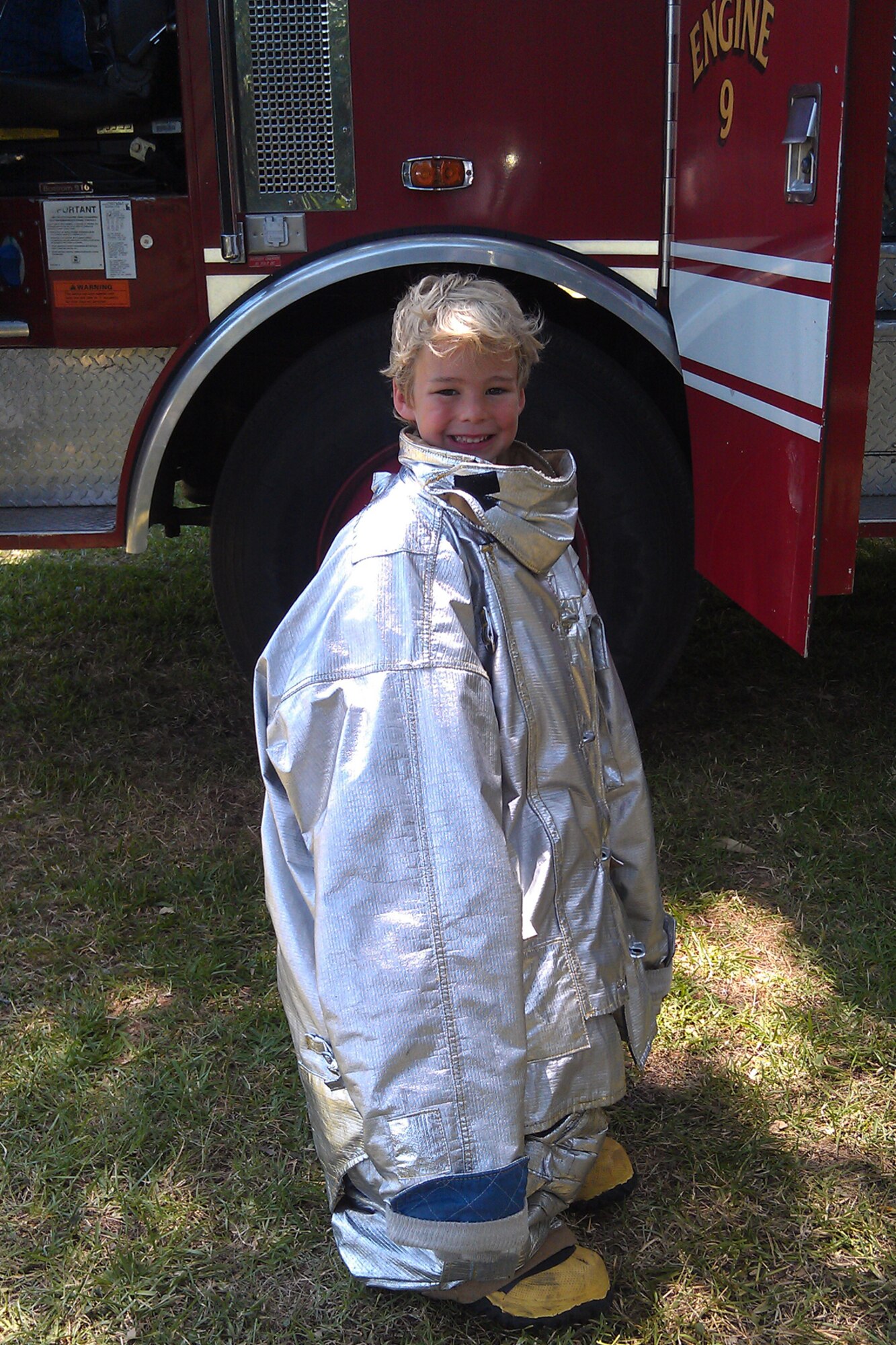 Five-year-old, Travis Wood, receives a little firefighting training during the 307th Bomb Wing/917th Fighter Group Family Day at Cullen Park on Barksdale Air Force Base, La., June 2, 2012. Travis’ dream job is to drive a big fire truck. He is the son of Master Sgt. Rachel Wood, budget analyst, 307th Bomb Wing, and Senior Master Sgt. David Wood, Air Ground Equipment Shop Supervisor, 307th Maintenance Squadron. The annual family day event provides an opportunity for the Reservists and their families to get together for some fun and camaraderie. (Courtesy photo)  