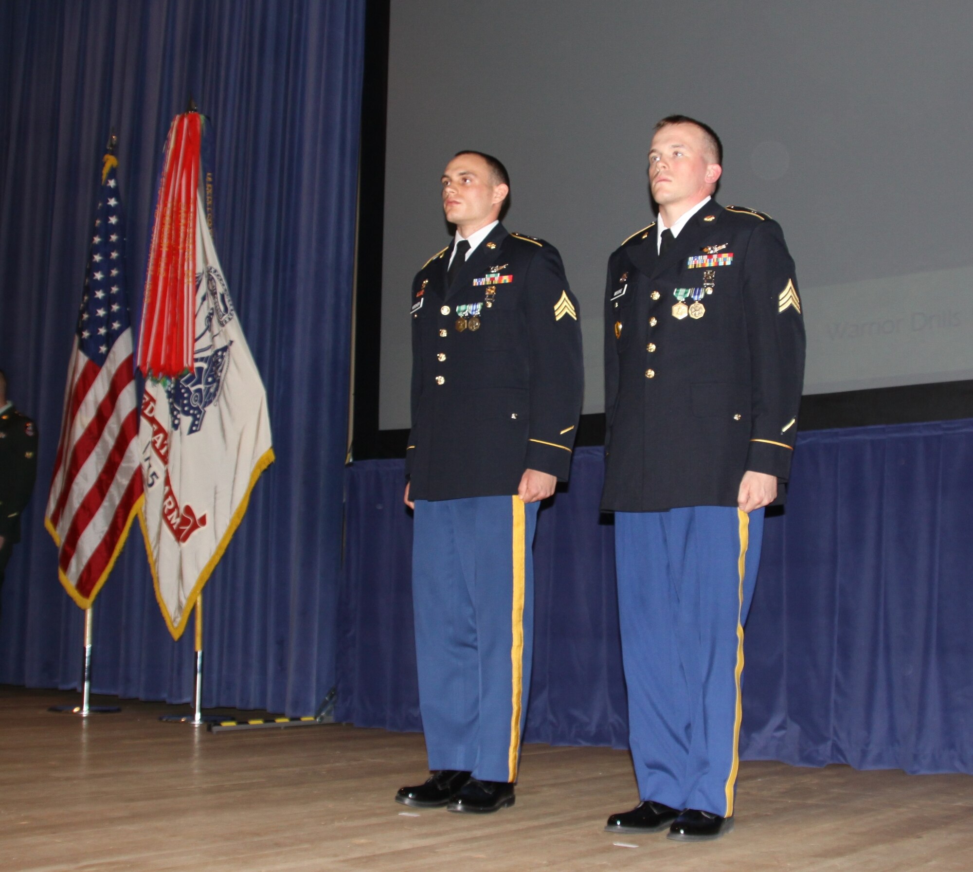Sgt. Brandon Kitchen (left), B Company, 53rd Signal Battalion, is named the U.S. Army Space and Missile Defense Command/Army Forces Strategic Command Noncommissioned Officer of the Year, and Sgt. Anthony Moore (right), Joint Tactical Ground Station-Europe, is named the command's Soldier of the Year during a ceremony at Peterson Air Force Base, Colo., on May 24 following the command's weeklong Best Warrior Competition. (U.S. Army photo/Dottie White)


