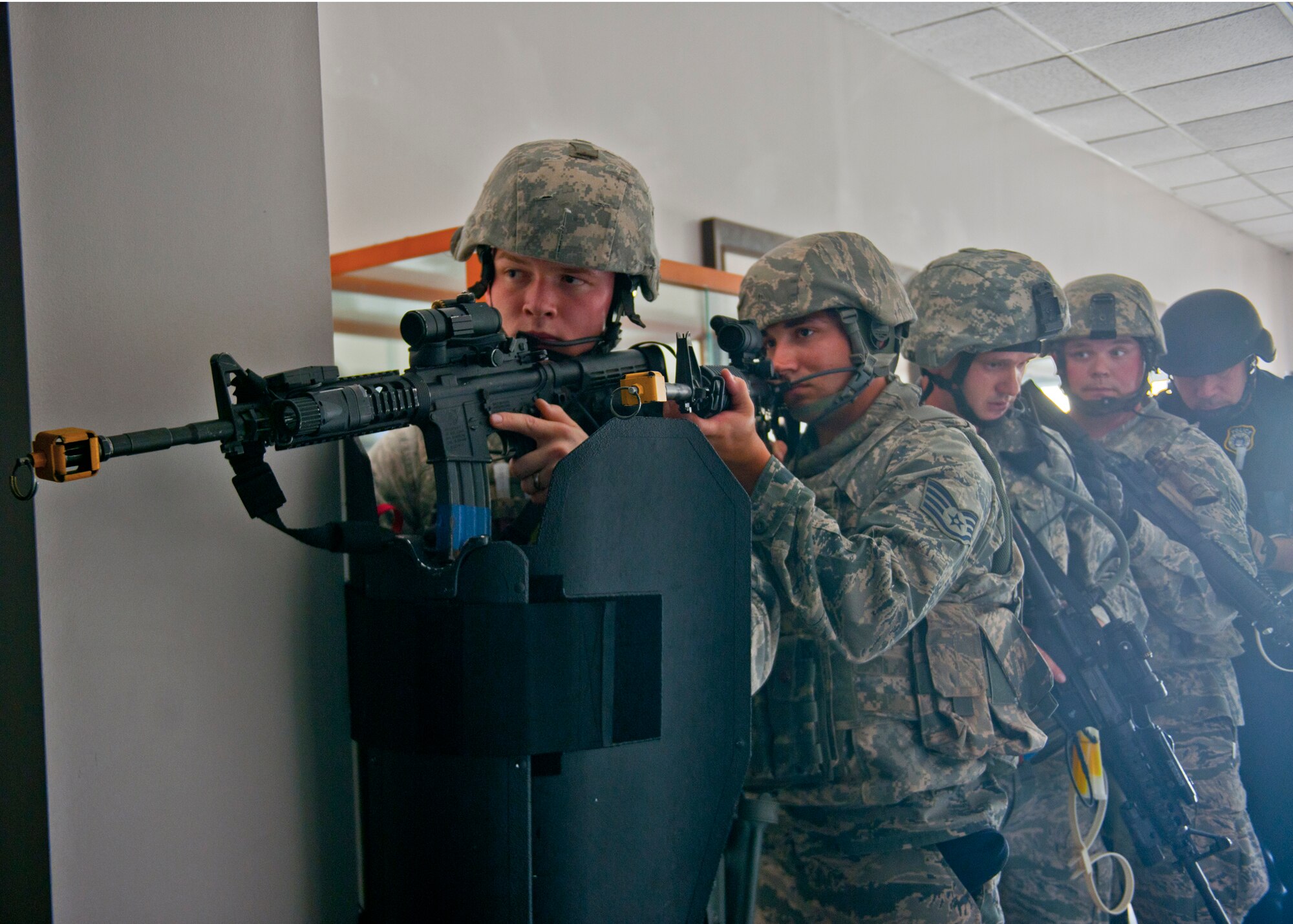 23d Security Forces Squadron Airmen respond to a simulated hostage situation during an active shooter exercise June 1, 2012, at Moody Air Force Base, Ga. The intent of the exercise was to prepare the base for real emergency situations involving a gunman. (U.S. Air Force photo by Senior Airman Eileen Meier/Released)