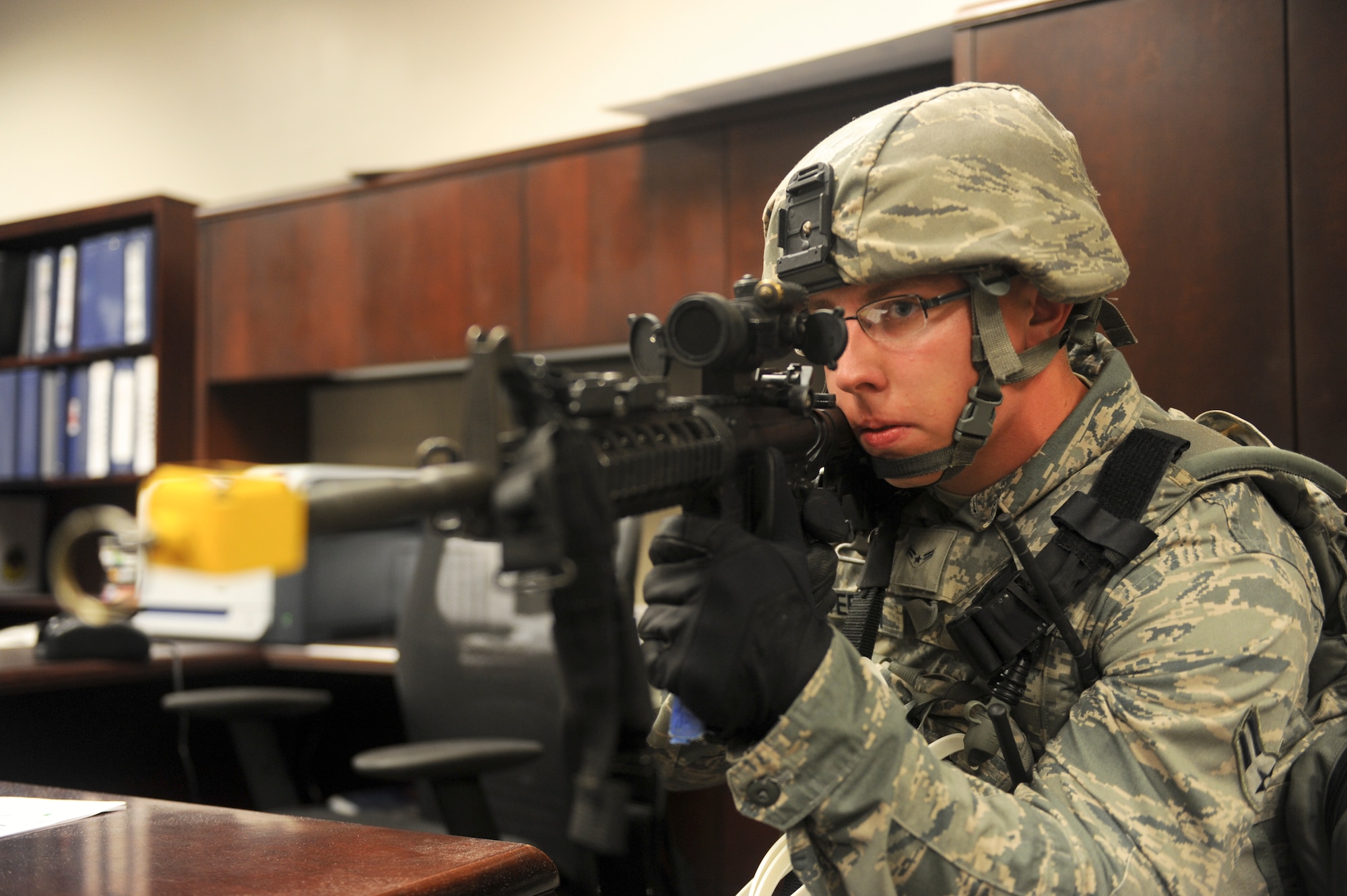 U.S. Air Force Airman 1st Class Jordan Patterson, 23d Security Forces Squadron fire team member, takes aim during an active shooter exercise at Moody Air Force Base, Ga., June 1, 2012. The exercise is an annual requirement for the wing to test its ability to respond to an active shooter. (U.S. Air Force photo by Airman 1st Class Douglas Ellis/Released)     
