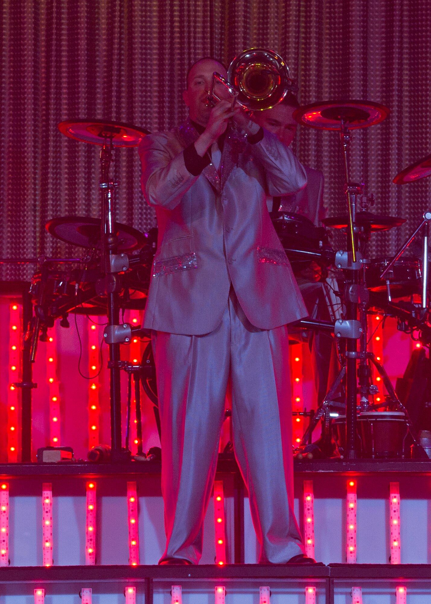 ALAMOGORDO, N.M. – Staff Sgt. Daniel Knight plays the trombone during a Tops in Blue performance at the Tays Center June 1. Knight, a health services management craftsman from the 21st Medical Operations Squadron at Peterson Air Force Base, Colo., is one of 35 Airmen serving as U.S. Air Force ambassadors in the Air Force’s premier expeditionary entertainment unit. The vocalists, musicians, dancers and technicians in the Tops in Blue 2012 tour are scheduled to perform more than 120 shows in 20 different countries this year. Each year, Air Force personnel stationed worldwide compete in a multilevel competition for the opportunity to be selected as a member of the unique unit. The Tops in Blue team is an all active duty Air Force special unit made up of talented performers selected for their entertainment abilities. Since its first world tour in 1953, the group has also performed on film, produced albums, and appeared on national television. This year’s performance featured songs by The Doobie Brothers, Earth, Wind & Fire, Whitney Houston, Maroon 5, Darius Rucker, Carrie Underwood, Lady Antebellum, The Zac Brown Band, as well as a tribute to the late Michael Jackson. (U.S. Air Force photo by Airman 1st Class Siuta B. Ika/Released)