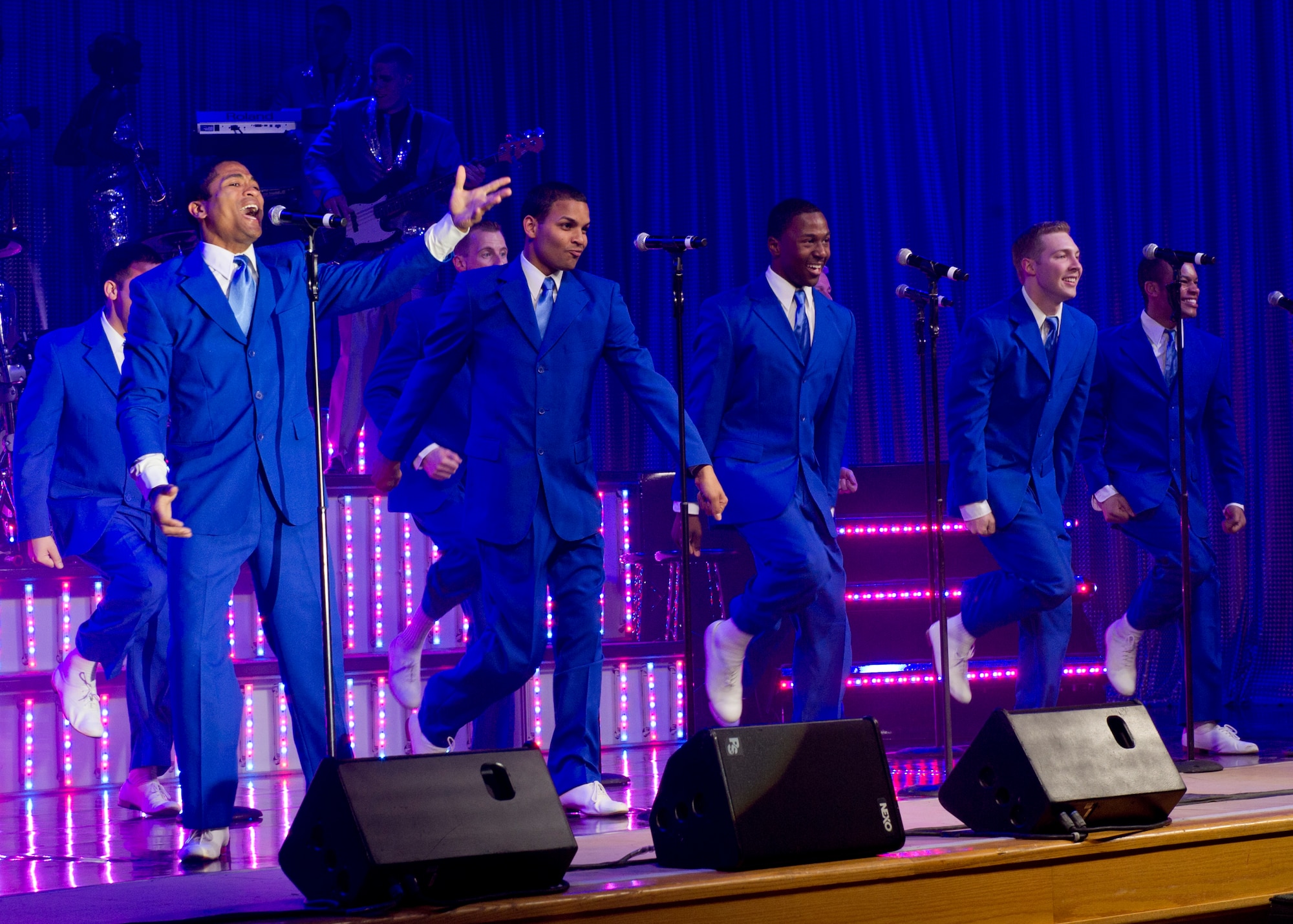 ALAMOGORDO, N.M. – Senior Airman Charles Cooper and other vocalists perform during a Tops in Blue performance at the Tays Center June 1. Cooper, a vehicle operator journeyman from the 86th Vehicle Readiness Squadron at Ramstein Air Base, Germany, is one of 35 Airmen serving as U.S. Air Force ambassadors in the Air Force’s premier expeditionary entertainment unit. The vocalists, musicians, dancers and technicians in the Tops in Blue 2012 tour are scheduled to perform more than 120 shows in 20 different countries this year. Each year, Air Force personnel stationed worldwide compete in a multilevel competition for the opportunity to be selected as a member of the unique unit. The Tops in Blue team is an all active duty Air Force special unit made up of talented performers selected for their entertainment abilities. Since its first world tour in 1953, the group has also performed on film, produced albums, and appeared on national television. This year’s performance featured songs by The Doobie Brothers, Earth, Wind & Fire, Whitney Houston, Maroon 5, Darius Rucker, Carrie Underwood, Lady Antebellum, The Zac Brown Band, as well as a tribute to the late Michael Jackson. (U.S. Air Force photo by Airman 1st Class Siuta B. Ika/Released)