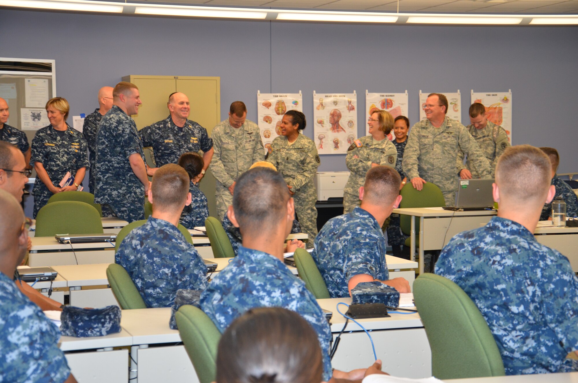 FORT SAM HOUSTON, TX (May 30, 2012) Navy and Air Force students in the Basic Medical Technician Corpsman Program at the Medical Education & Training
Campus (METC) received a rare and memorable treat when Lt. Gen. Charles Green, 
surgeon general of the Air Force; Vice Adm. Matthew Nathan, surgeon general of 
the Navy and chief, Bureau of Medicine and Surgery; and Lt. Gen. Patricia Horoho, surgeon general and commanding general, U.S. Army Medical Command and their senior enlisted leaders stopped by the students' classroom during a visit to METC on May 30. (U.S. Navy photo by Lisa Braun/Released).
