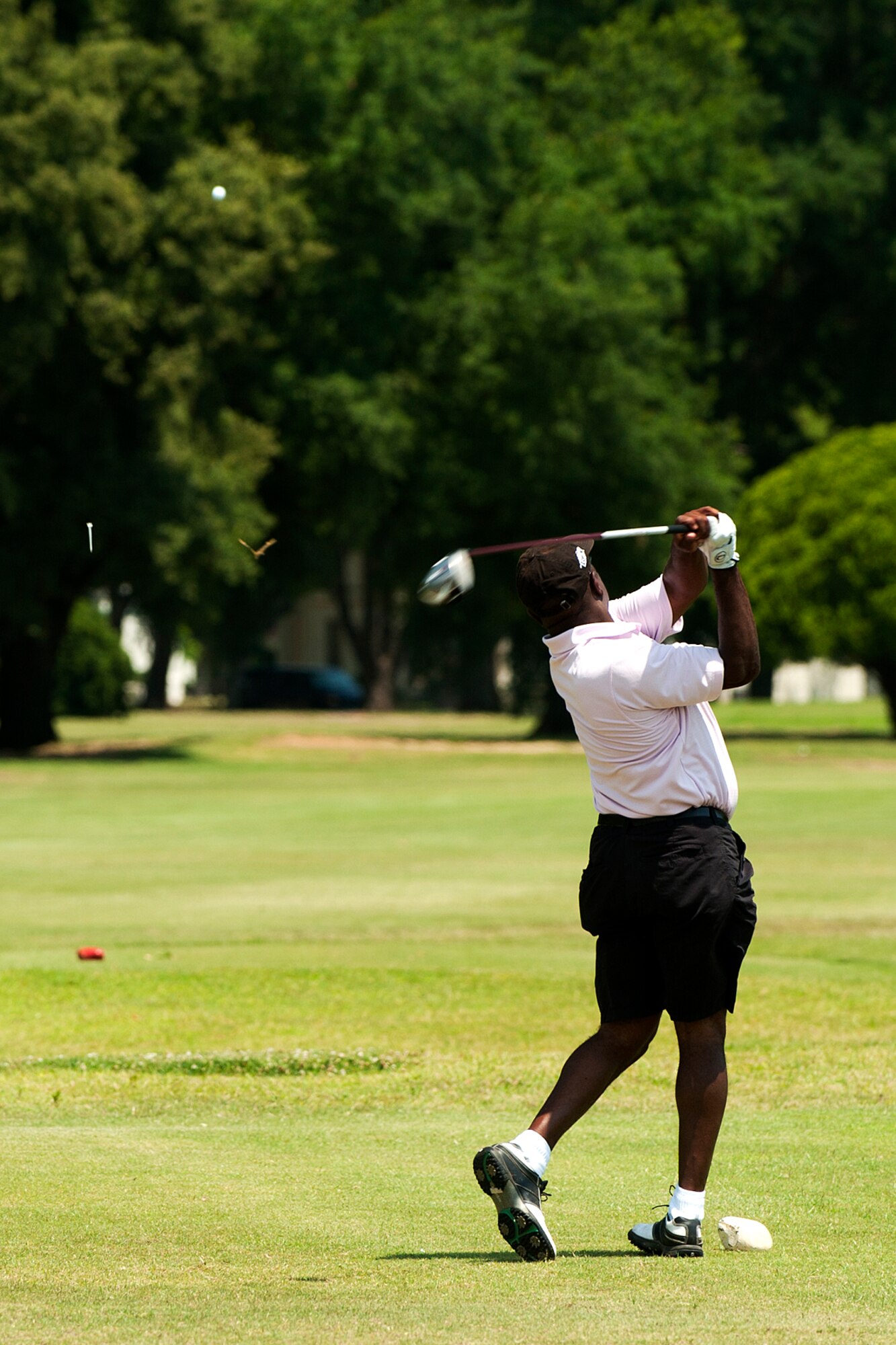 A member of the 307th Medical Squadron tees off during the Commander’s Cup Golf Tournament, Barksdale Air Force Base, La., June 2, 2012. Over 100 players participated in the event, which included personnel from both the 307th Bomb Wing and 917th Fighter Group. (U.S. Air Force photo by Master Sgt. Greg Steele/Released)