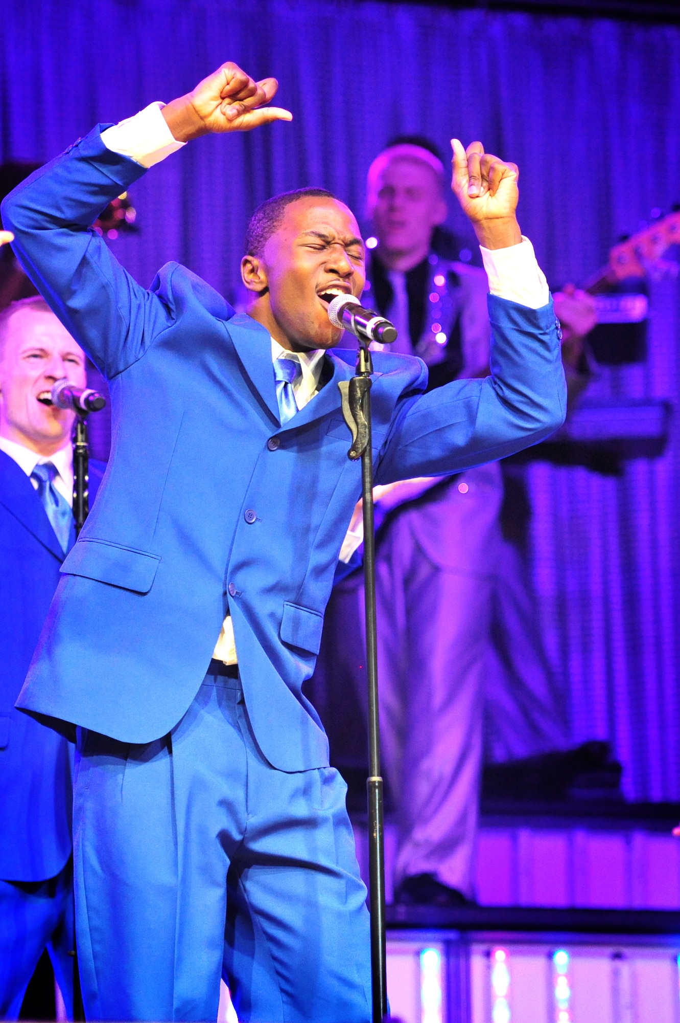 U.S. Air Force Airman 1st Class Jonathan Leak, 324th Intelligence Squadron Joint Base Pearl Harbor-Hickam, Hawaii, hits a high notes during the first 2012 Tops in Blue performance held at Marshall Auditorium, Clovis, N.M., May 28, 2012. The ensemble provides quality entertainment utilizing talented Airmen from every rank within the force. (U.S. Air Force photo by Airman 1st Class Alexxis Pons Abascal)  