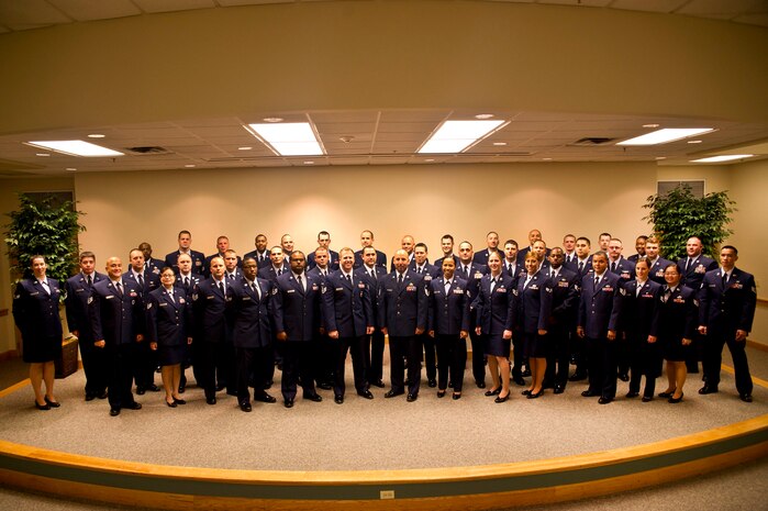 Community College of the Air Force graduates pose for a group photo at the Education Center on Joint Base Charleston - Air Base, S.C., May 31, 2012. Forty-eight Airmen attended the graduation for their diplomas, however more than 150 Airmen graduated and received their CCAF degree. (U.S. Air Force photo by Airman 1st Class George Goslin)