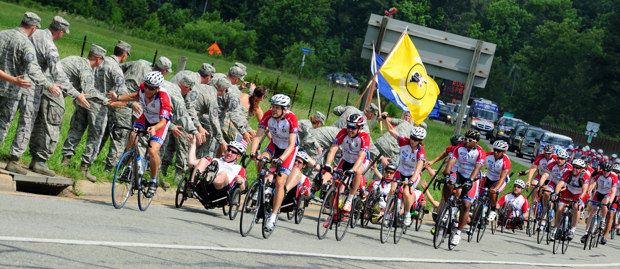 Bicyclists ride by Langley Air Force Base, Va., as part of the Ride 2 Recovery Memorial Challenge, June 1, 2012. The riders started their five-day ride in Washington, DC., and ended in Virginia Beach, Va., June 2.  (U.S. Air Force photo by Airman 1st Kayla Newman/Released)