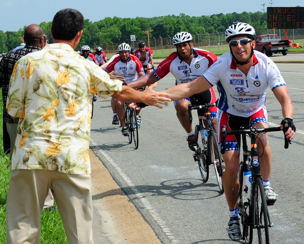 Bicyclists ride by Langley Air Force Base, Va., June 1, 2012, as part of the Ride 2 Recovery Memorial Challenge. The program raises donations to support participation of wounded warriors and veterans in events like the Ride 2 Recovery.  (U.S. Air Force photo by Airman 1st Kayla Newman/Released)
