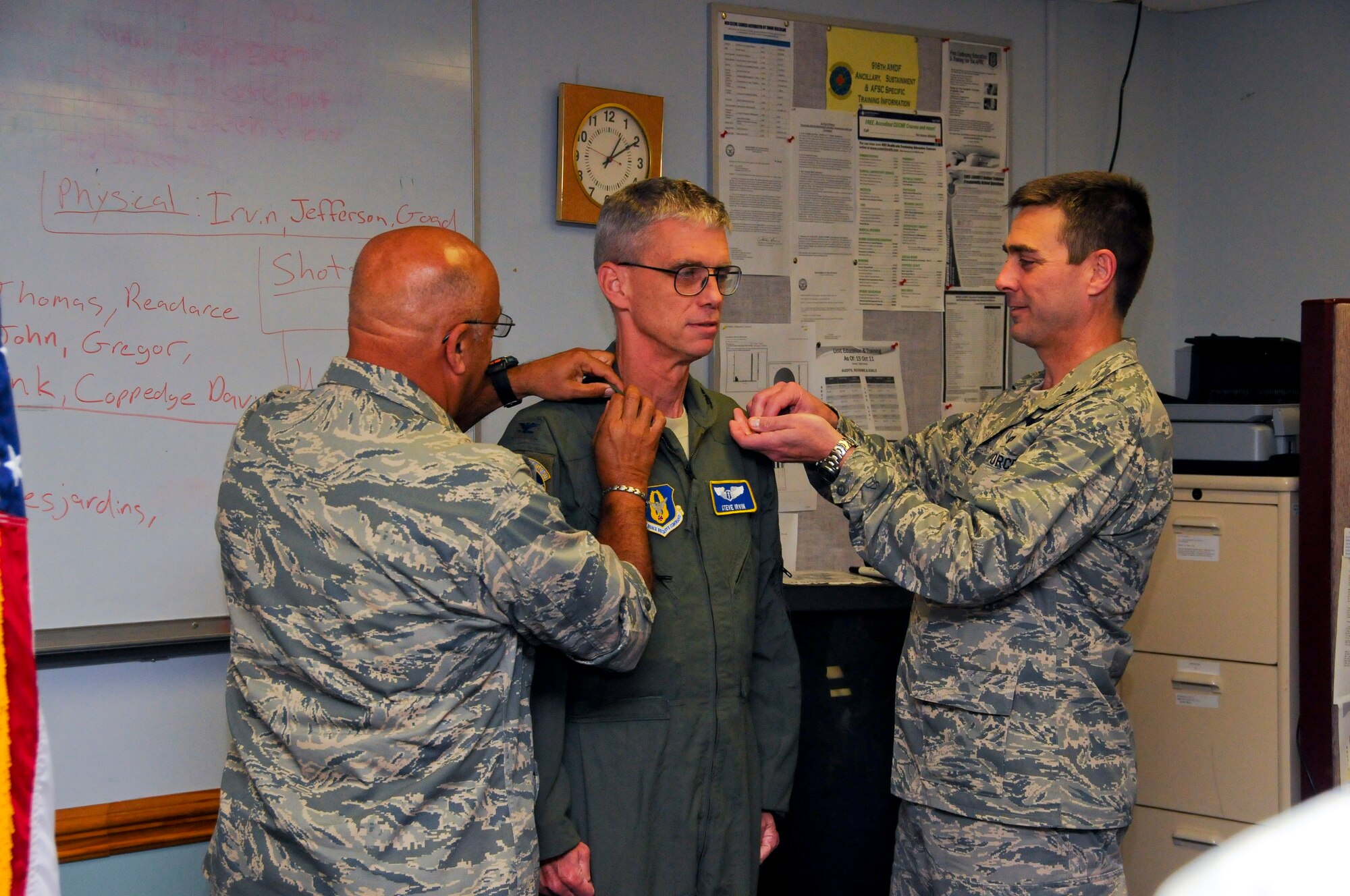 Reservist Stephen Irvin, center, is promoted to the rank of colonel in May 2012. Dr. Irvin serves with the 916th Aerospace Medicine Squadron and was promoted by Col. Ed San Miguel and Col. Laen August. (USAF photo by Tech. Sgt. Scotty Sweatt, 916ARW/PA, released)